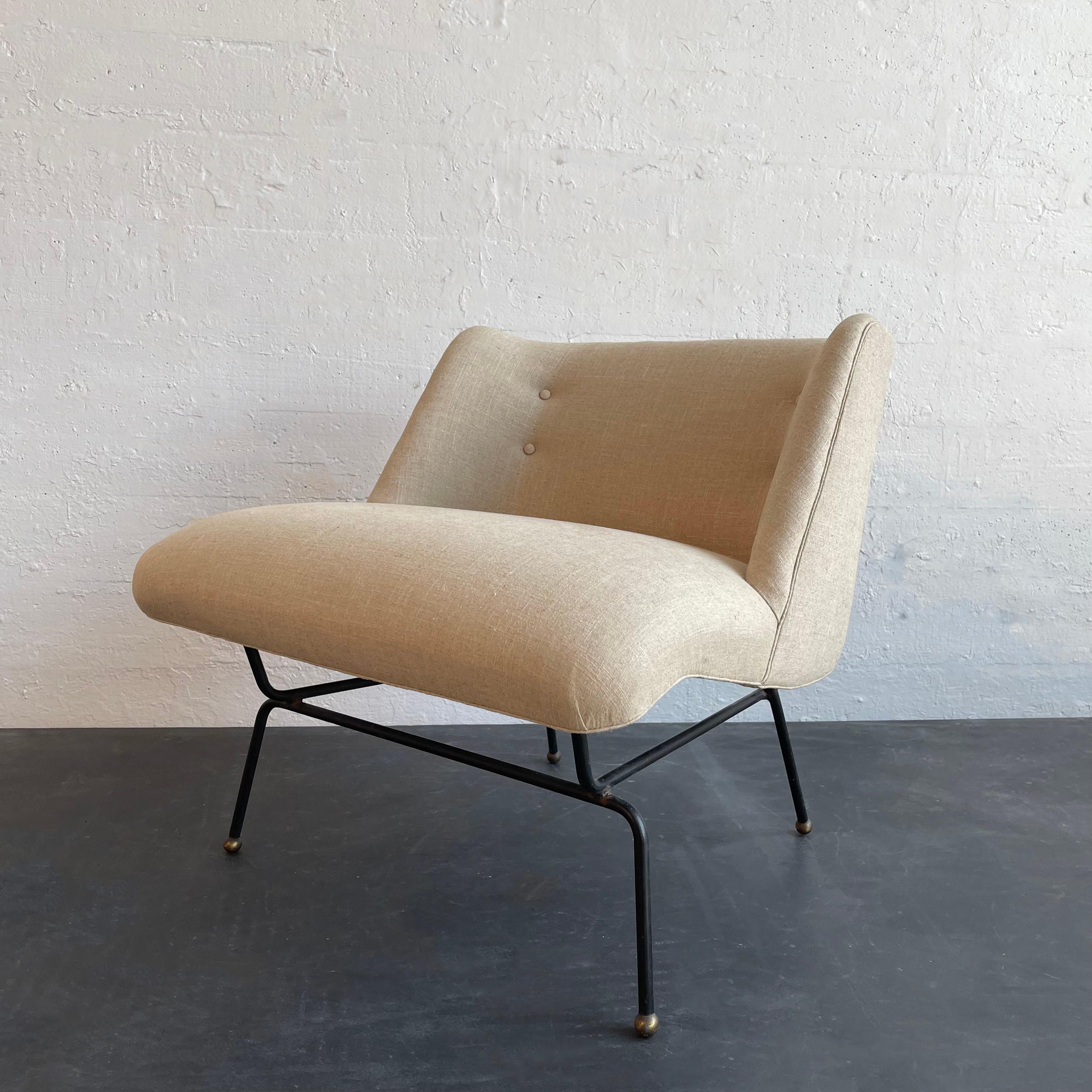 Elevate your decor with this rare, mid-century modern, lounge slipper chair by Dan Johnson for Pacific Iron. This chair features a sleek, minimal, wrought iron frame finished with ball feet. The contoured seat and back are newly upholstered in 
