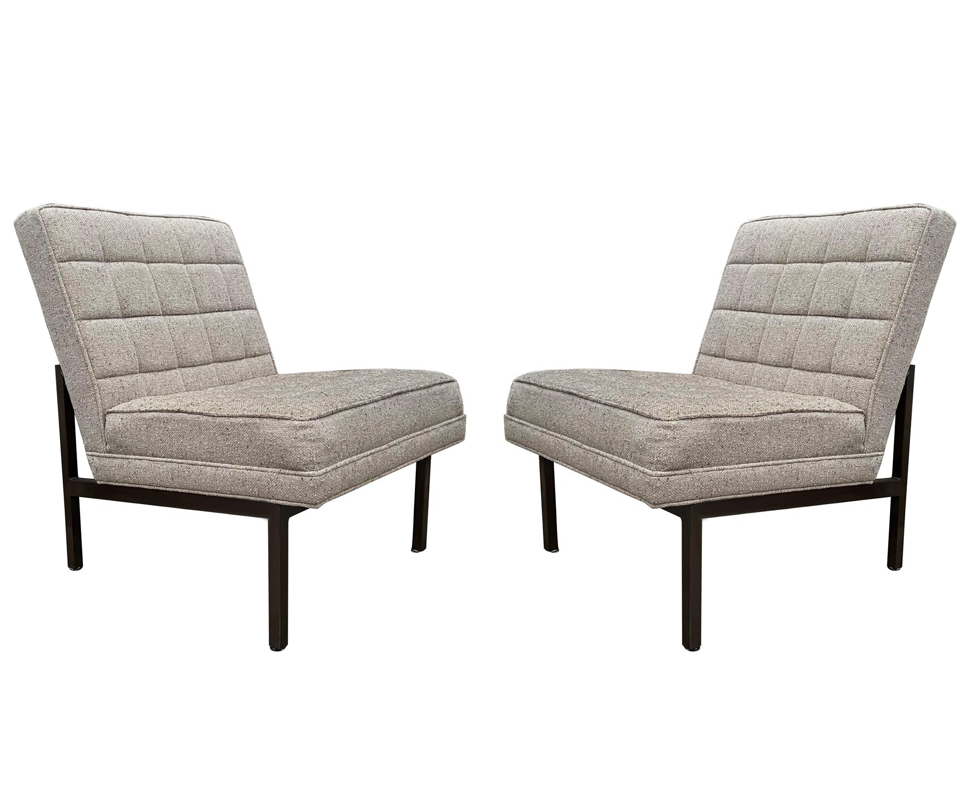 A simple and sleek modern pair of slipper chairs after Florence Knoll circa 1970's. These feature their original upholstery with bronze finished steel frames. Very usable as is.