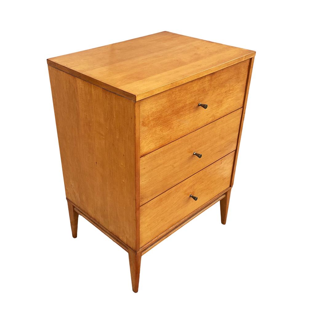 A beautiful 1950's small chest of drawers by Paul McCobb and produced by Winchendon. A versatile piece constructed of solid maple with warm patinated brass pulls.