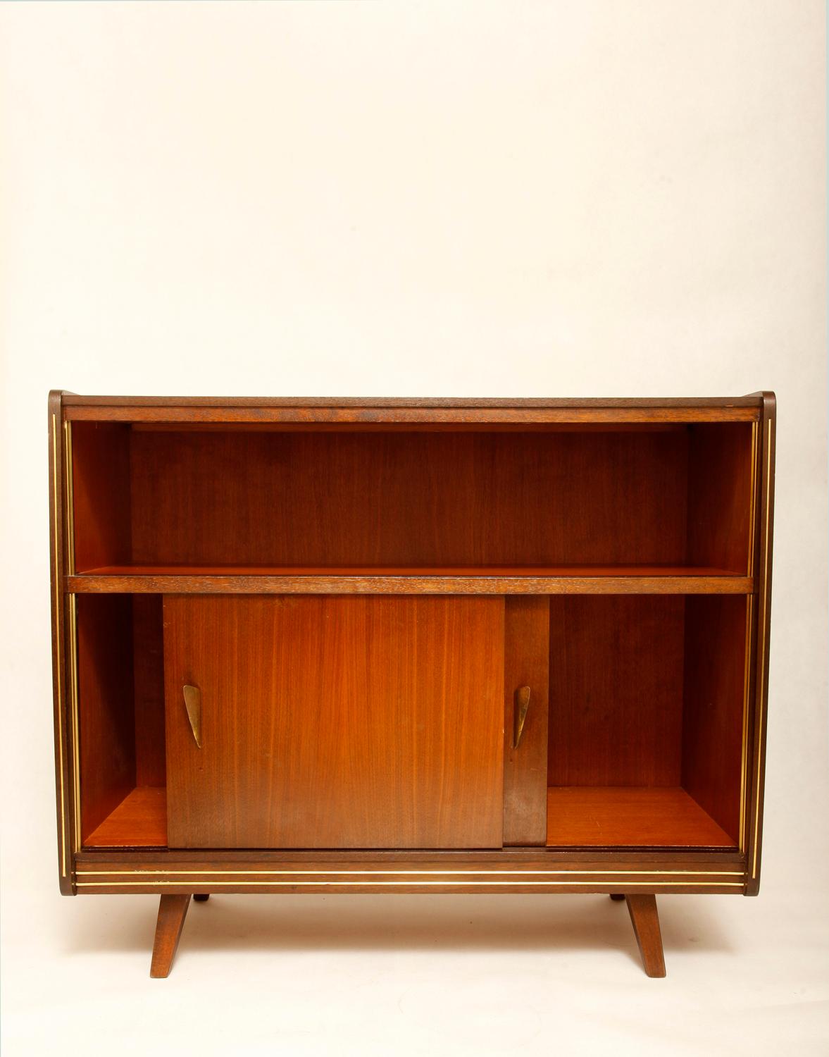 A small but very shapely German cupboard / commode / helper with various uses. Sliding door and two shelves in the middle. Preserved in a very good natural vintage condition. Originally, in the upper part, it had a few narrow glass sliding doors,