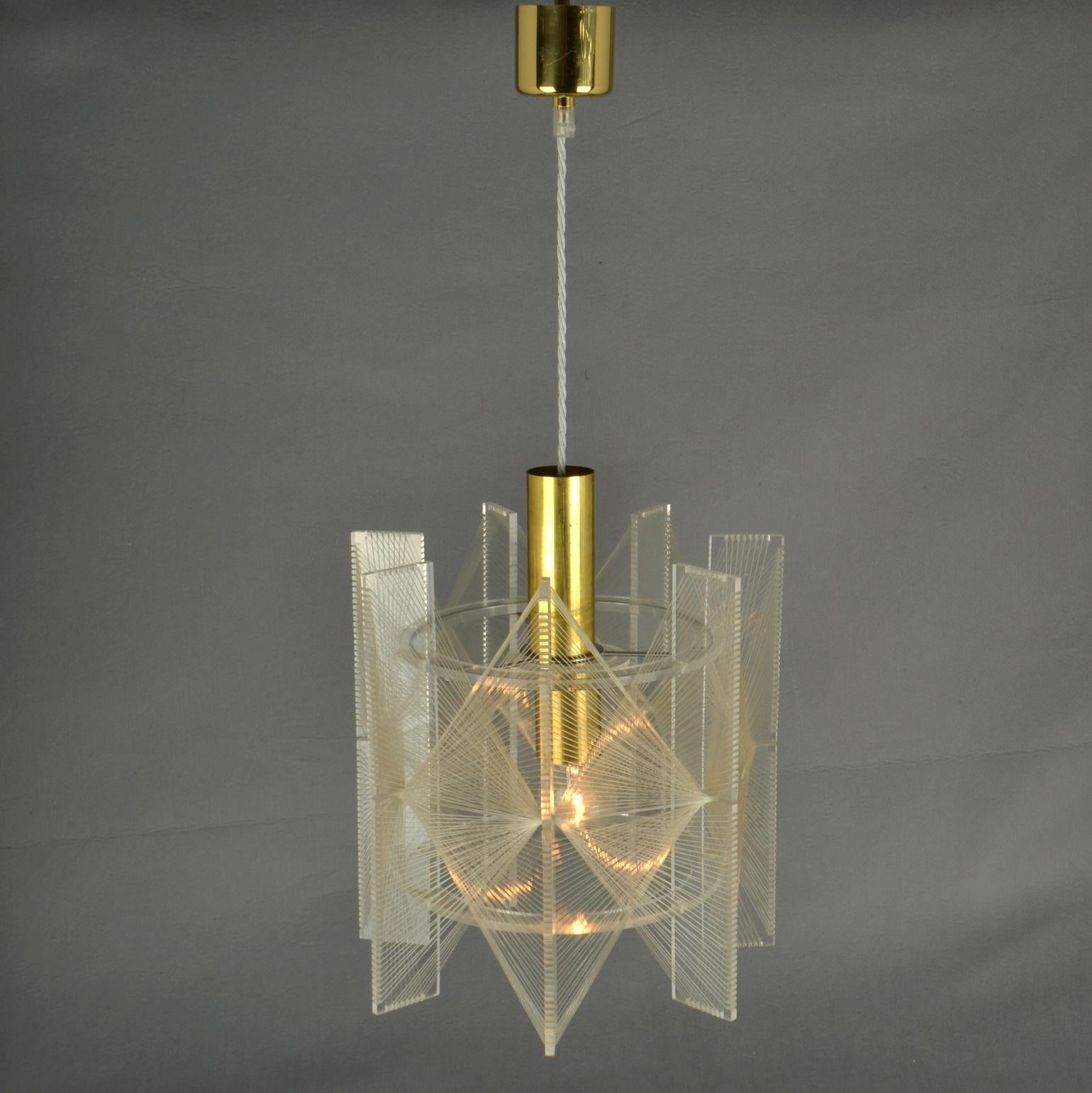 Sculptural small lamp in cone shape of clear acrylic / Perspex and clear transparent wire accompanied brass internal fittings holder. The design is influenced by the pioneer, Avant Garde artist and sculptor Naum Gabo (1890–1977). 
These lamps are