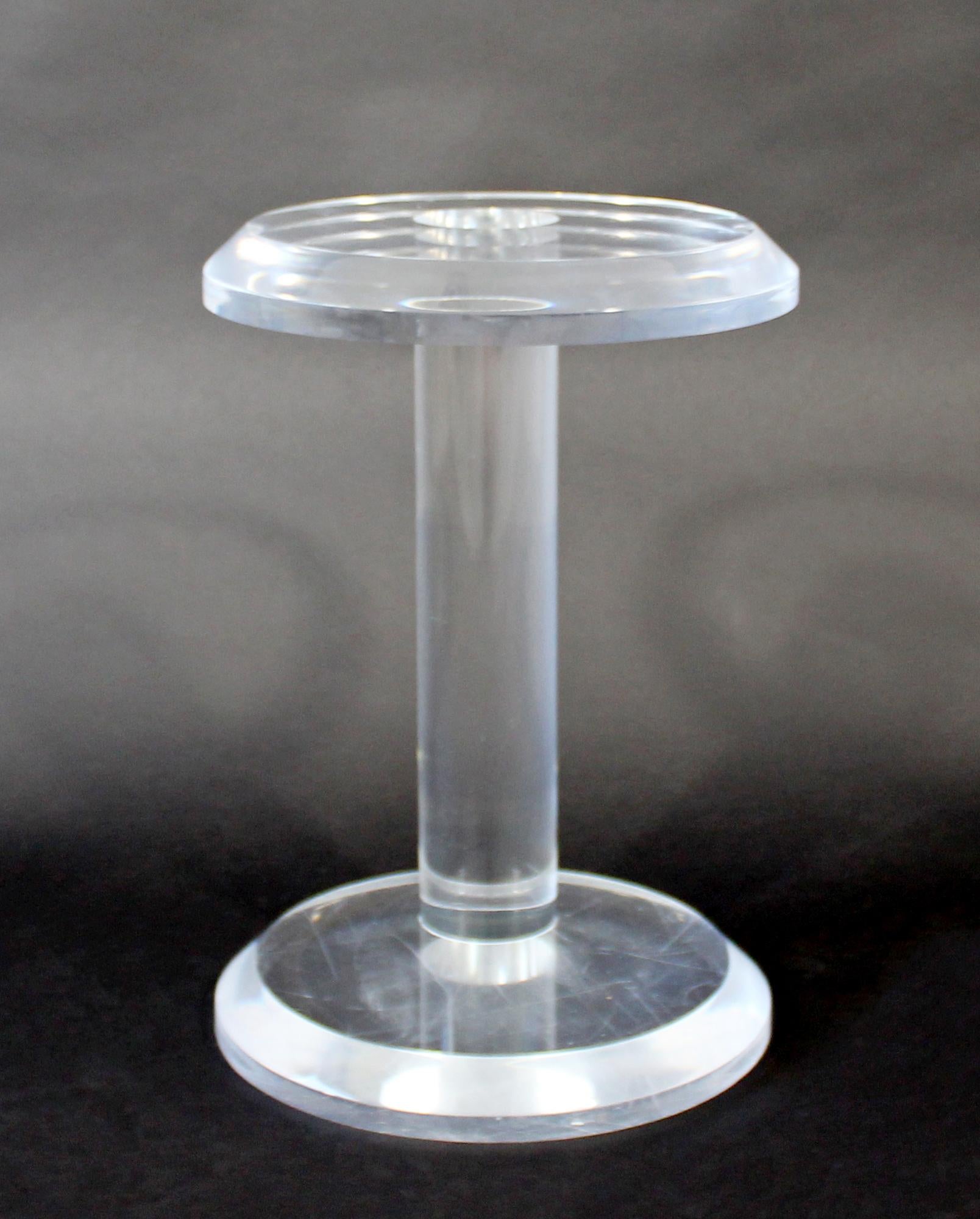 For your consideration is a Minimalist, small and round, Lucite or acrylic side or end table, circa the 1970s. In very good vintage condition. The dimensions are 12