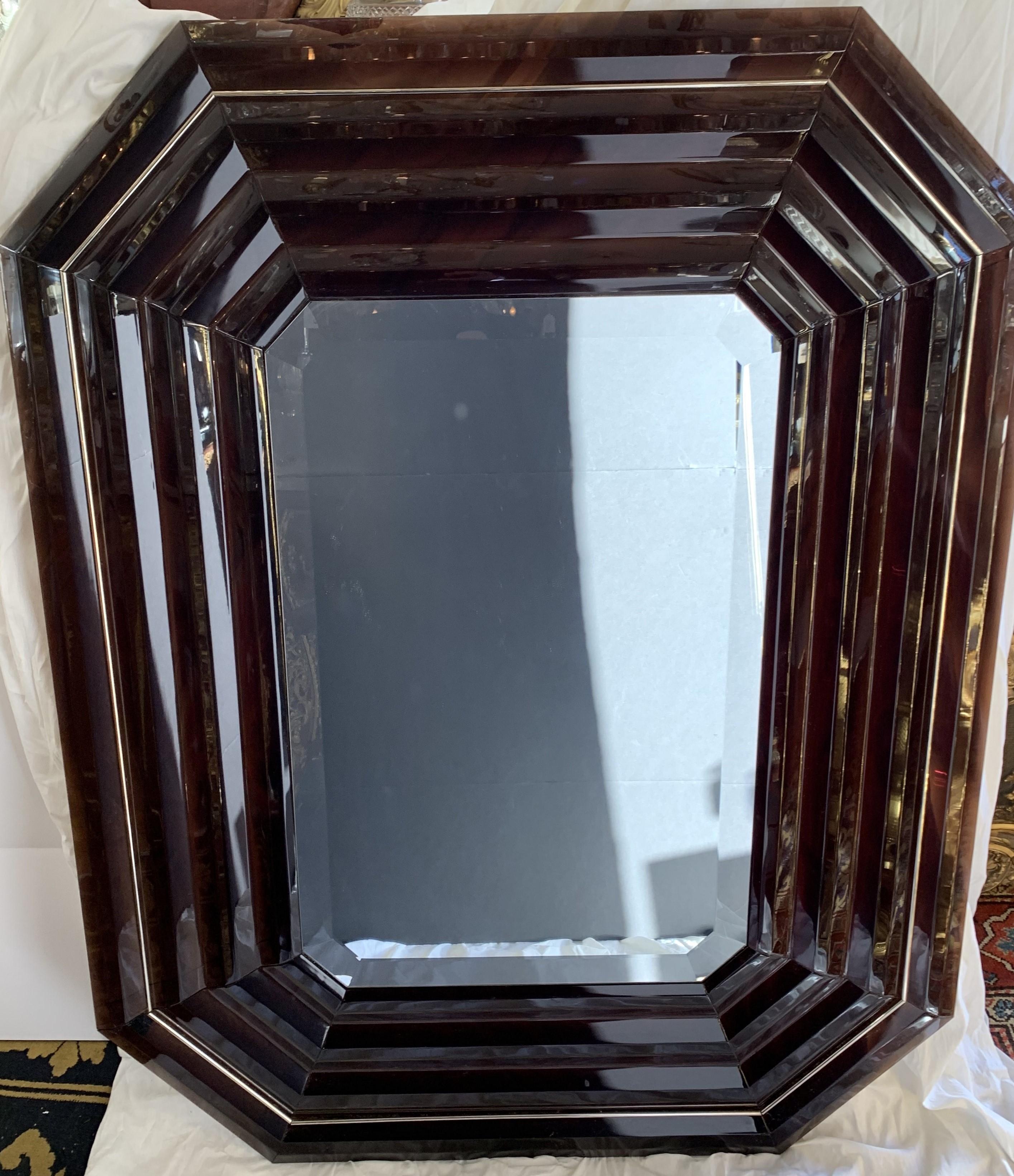 A beautiful Mid-Century Modern smoke Lucite beveled emerald shape and polished nickel mirror
purchased from Lorin Marsh.
