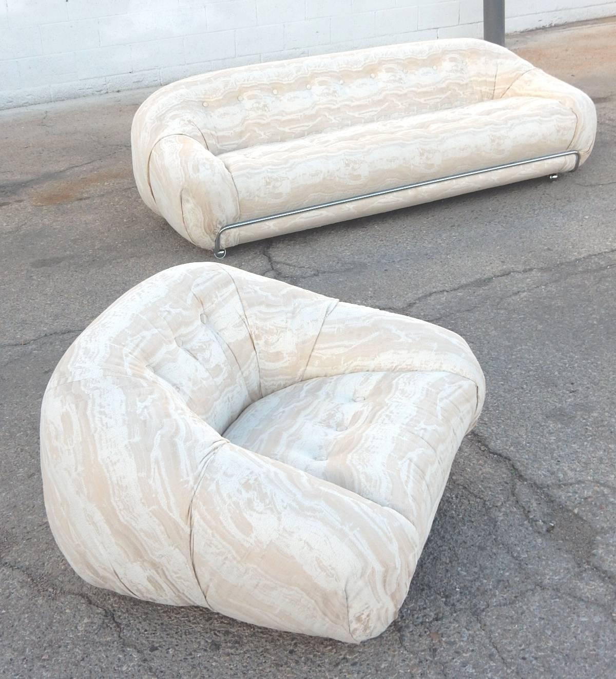 Matching sofa and lounge chair in the manner of Tobia Scarpa.
Italian design, circa 1970s, this set is in immaculate condition upholstered in
the highest quality vintage natural tone marble print fabric.
Chrome tube across front floating on