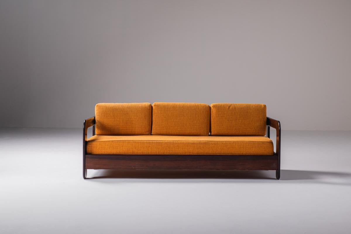 Mid-Century Modern Sofa by Unattributed designer, Brazil, 1960s.

This three-seater sofa is a striking piece of furniture crafted by a Brazilian designer. It is constructed from high-quality solid wood, providing both durability and an elegant