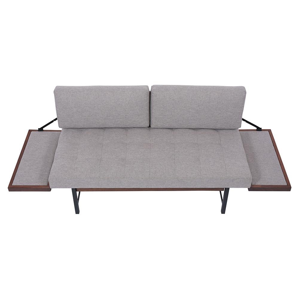 This Mid-Century Sofa Bed is crafted out of walnut wood and metal combination that has been fully restored. This sofa features a squared tufted design seat, two backrest cushions, and is newly upholstered in a grey fabric with new foam inserts. The