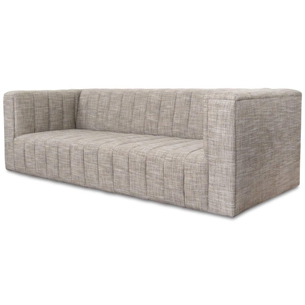 Introducing the Monaco Sofa. The front of the sofa features top to floor channel tufting creating striking vertical lines on a chubby modern frame. Customizable plush linen highlights this sleek look. The symmetry of the design of the Monaco Sofa