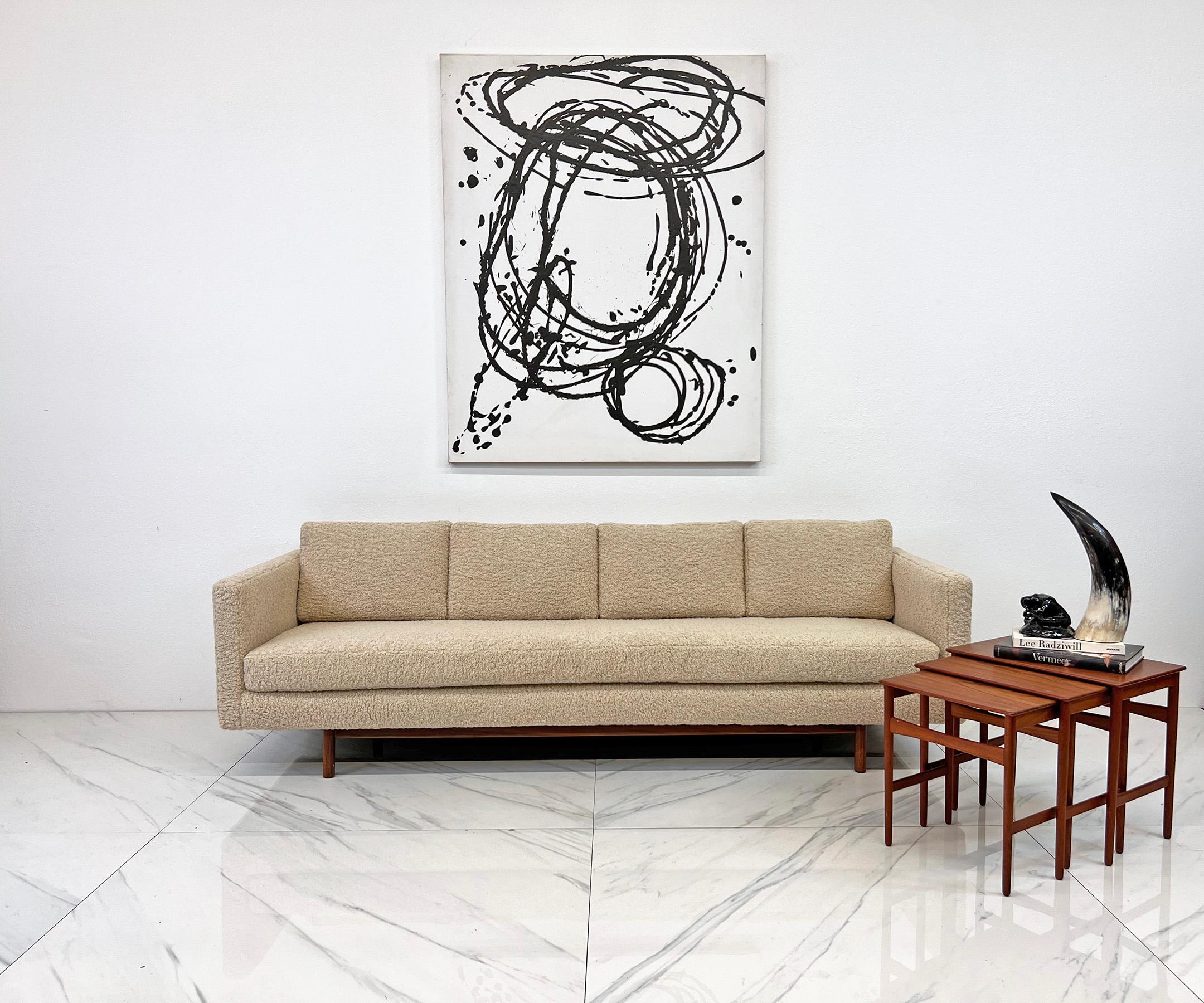 Step into a time machine and transport your living room back to the fabulous 1950s with our exquisite vintage tuxedo sofa. Inspired by the iconic designs of Milo Baughman and Paul McCobb, this piece is the epitome of mid-century modern elegance with