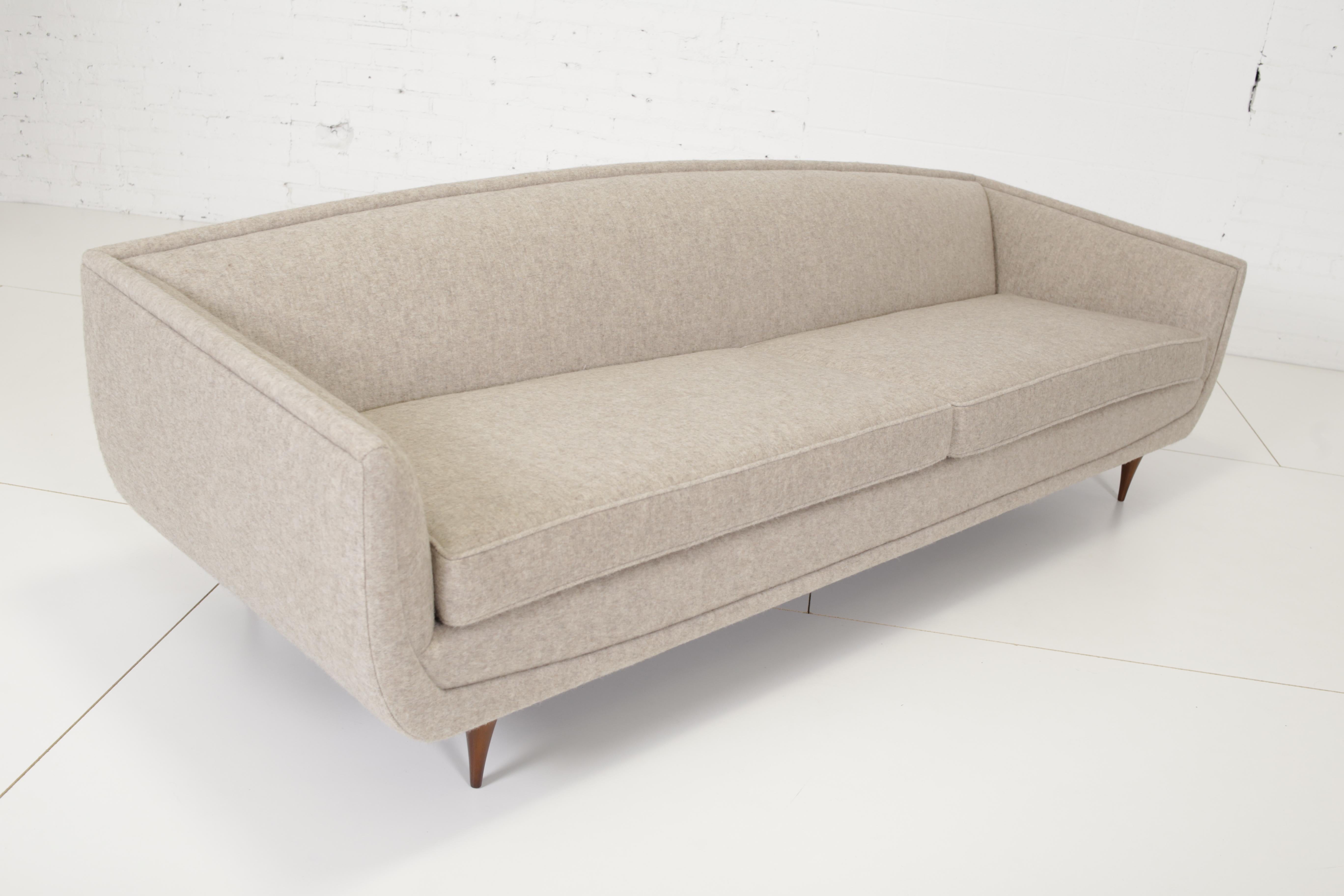 Rare modernist sofa by Karpen of CA Furniture. Fully restored and reupholstered in felted wool/alpaca blend upholstery.