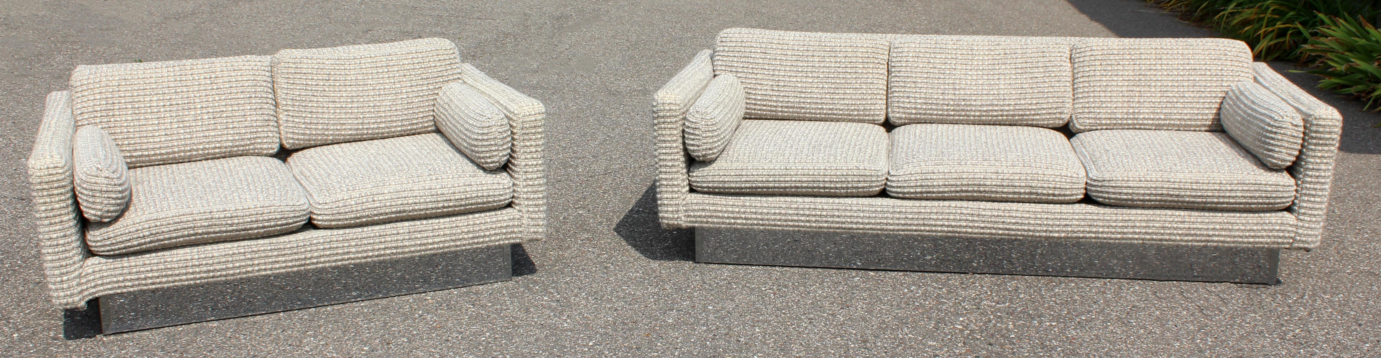 For your consideration is a gorgeous sofa and love seat on a chrome plinth base, set by Milo Baughman for forecast furniture, circa the 1970s. In excellent condition. The dimensions are 83