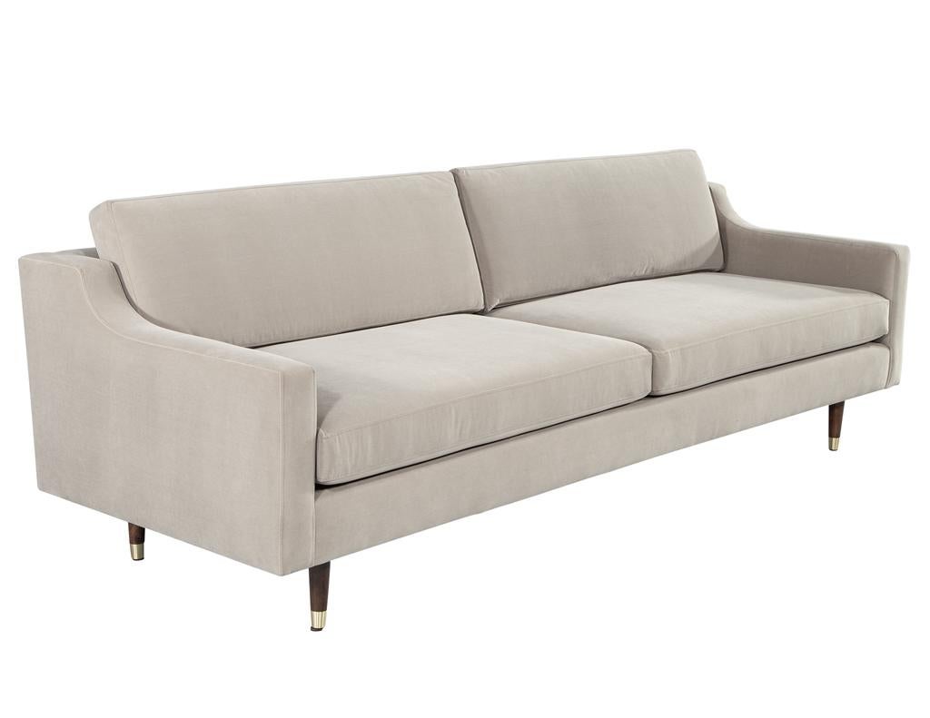 Vintage Mid-Century Modern sofa. Custom reupholstered with a designer velvet fabric. Classic anodized black legs with brass metal accents. Sleek mid-century modern styling, America, circa 1960's. Fully restored like new.

Frame H: 28.5