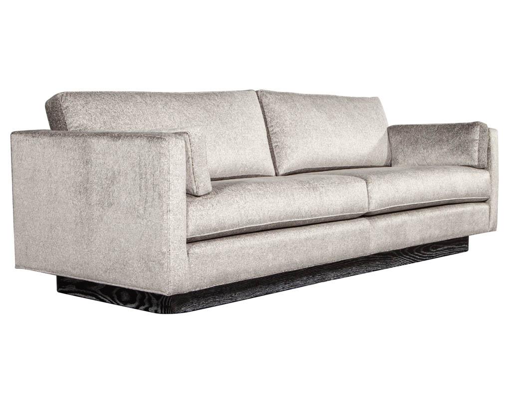 Mid-Century Modern sofa with Ceruse oak base. Outstanding restored sofa with a luxurious designer champagne silver fabric perched on an elegant ceruse solid oak platform.

Price includes complimentary scheduled curb side delivery to the