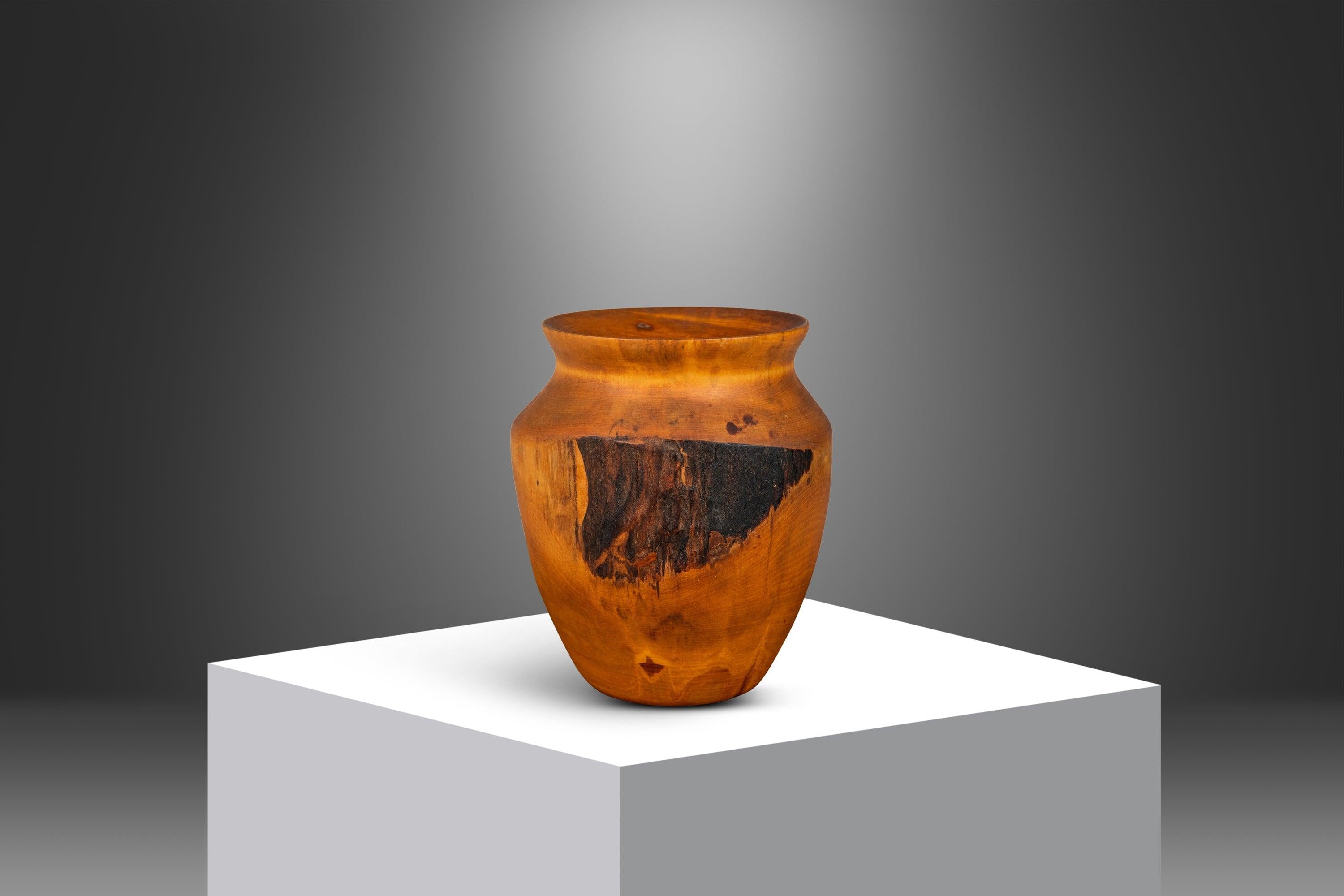 Handmade by the renowned wood-worker Joseph Thompson, this wood-turned vase is absolutely exquisite. Carved out of solid birch from Montana, this gorgeous vase boasts exquisite woodgrains and craftsmanship synonymous with Thompson's work. Make it