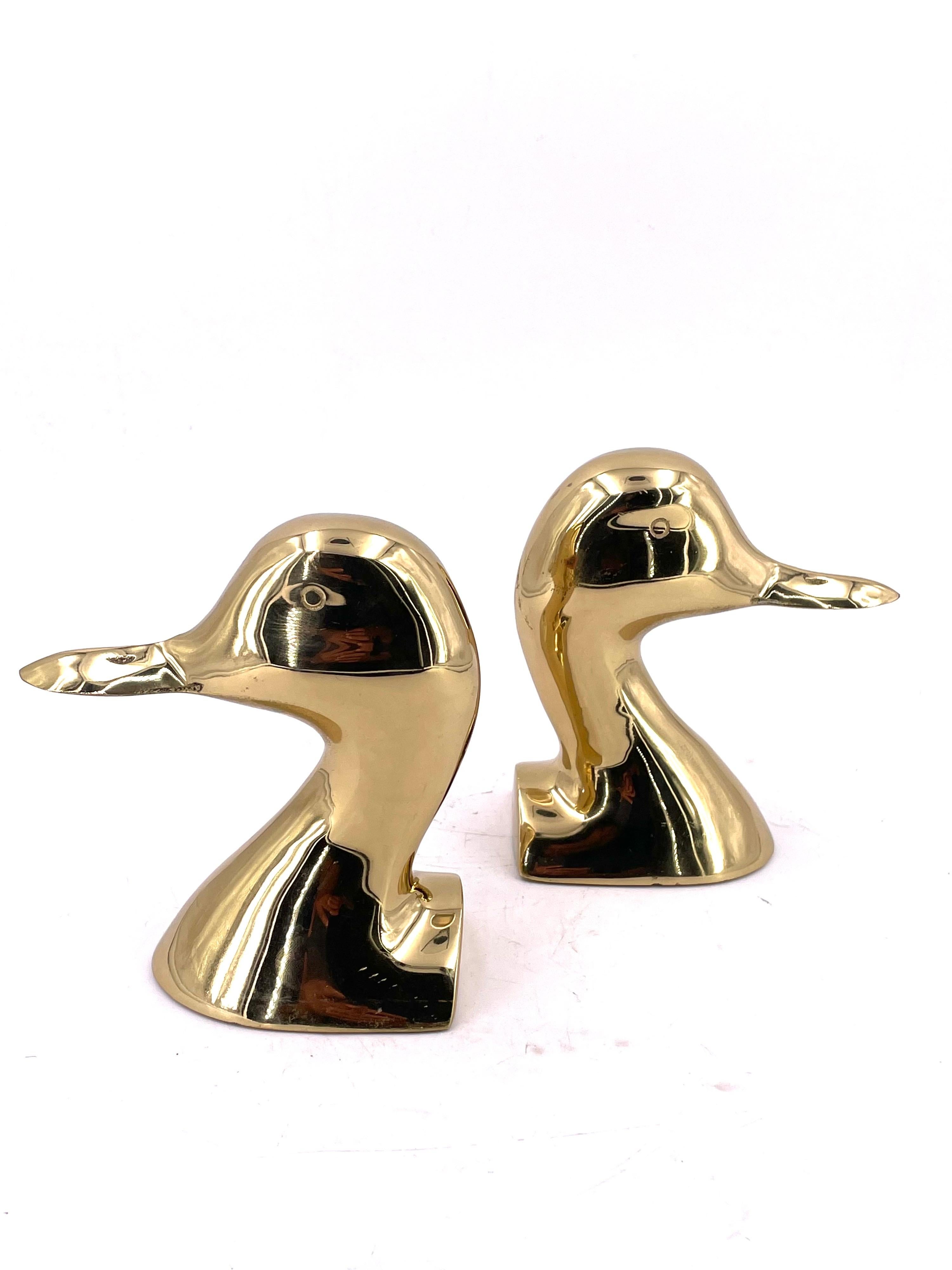 Nicely light polished brass bookends, duck heads, circa the 1970s. Stamped Made in the USA solid and heavy quality.