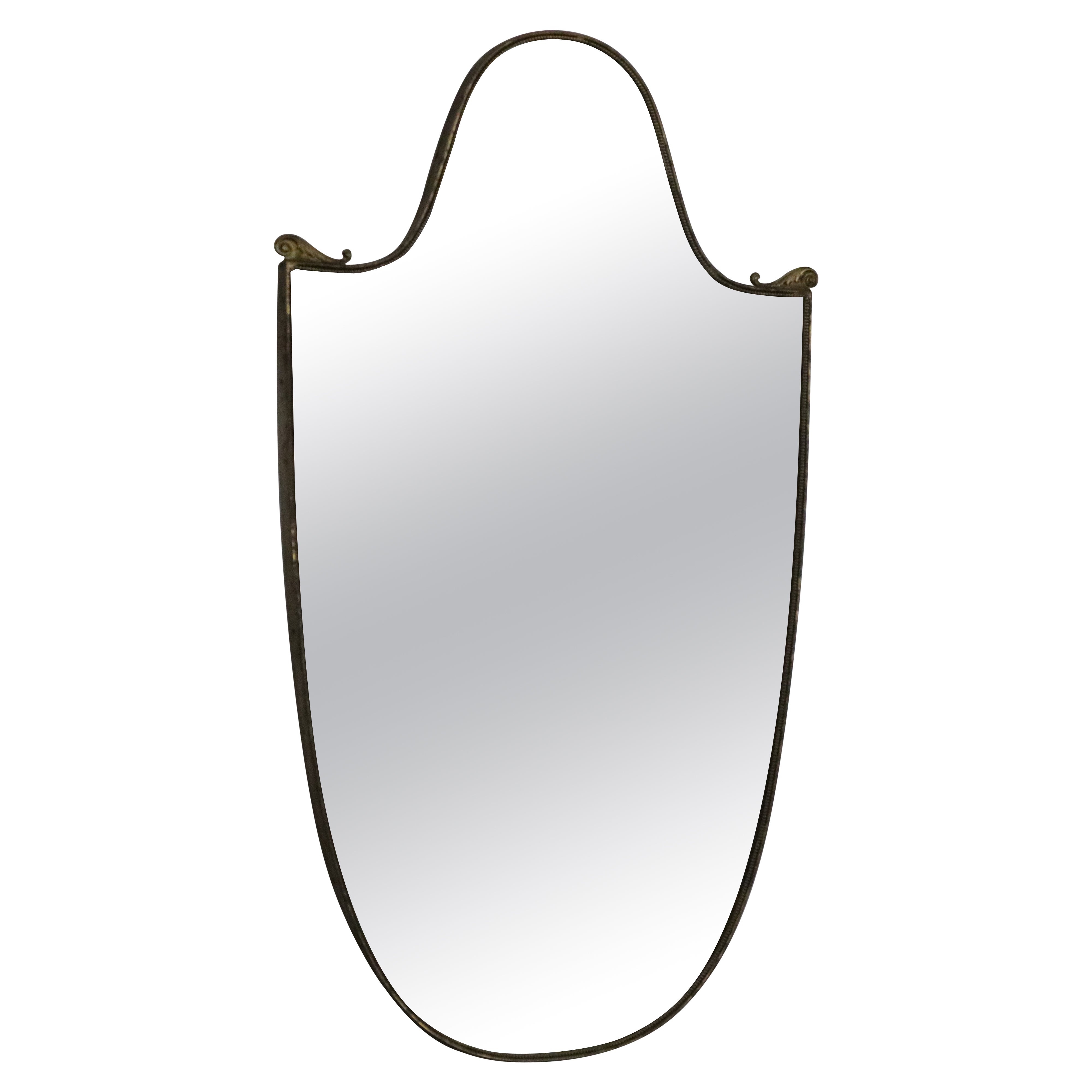 Mid-century modern solid brass shield shape mirror, Italy, 1960s For Sale