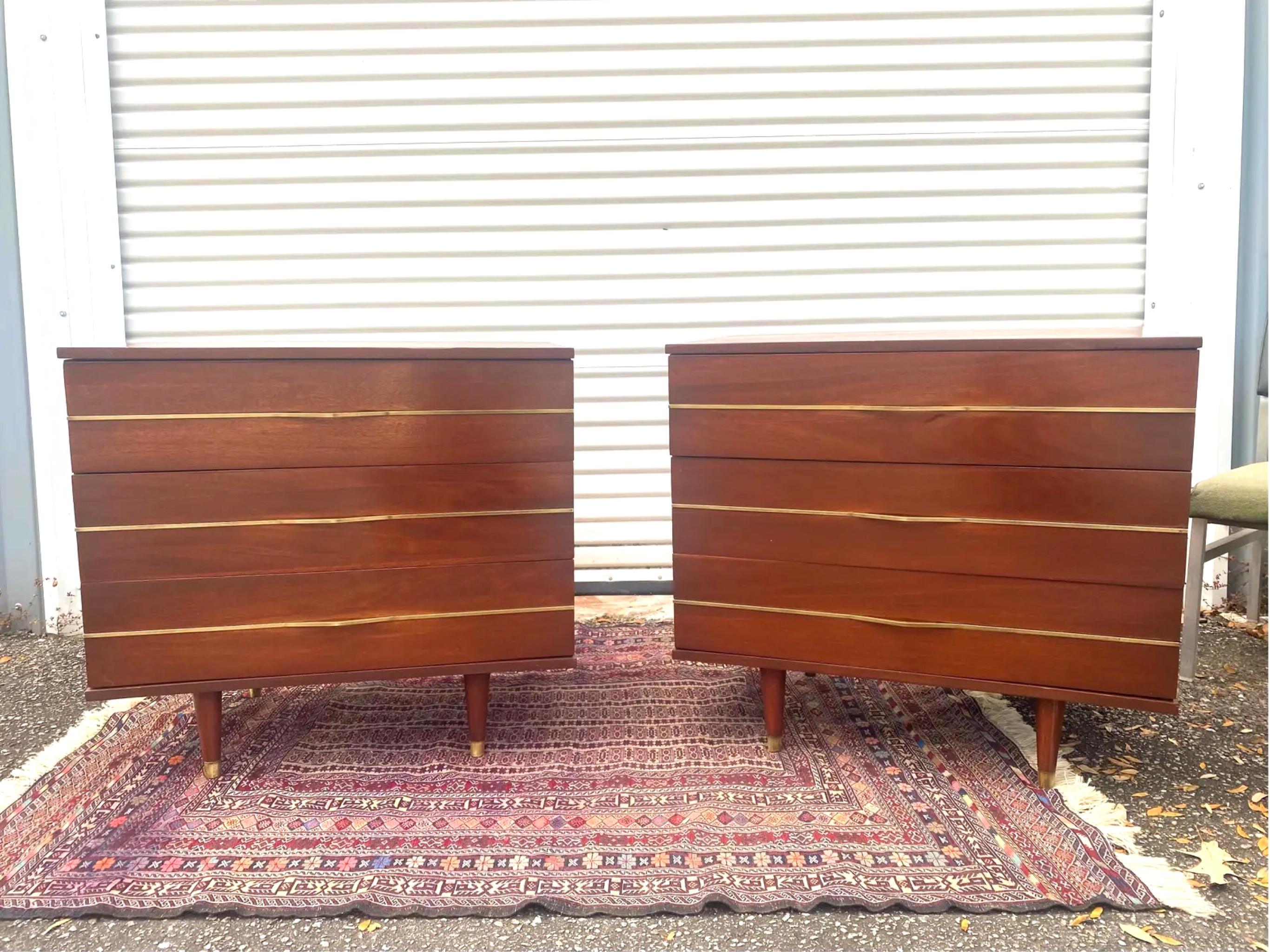 A rare find of solid mahogany commode chests by Link Taylor that have been newly refinished. These vintage commode dressers consist of three dovetailed drawers with a solid brass band bisecting each drawer and serving as drawer pulls. Each band has