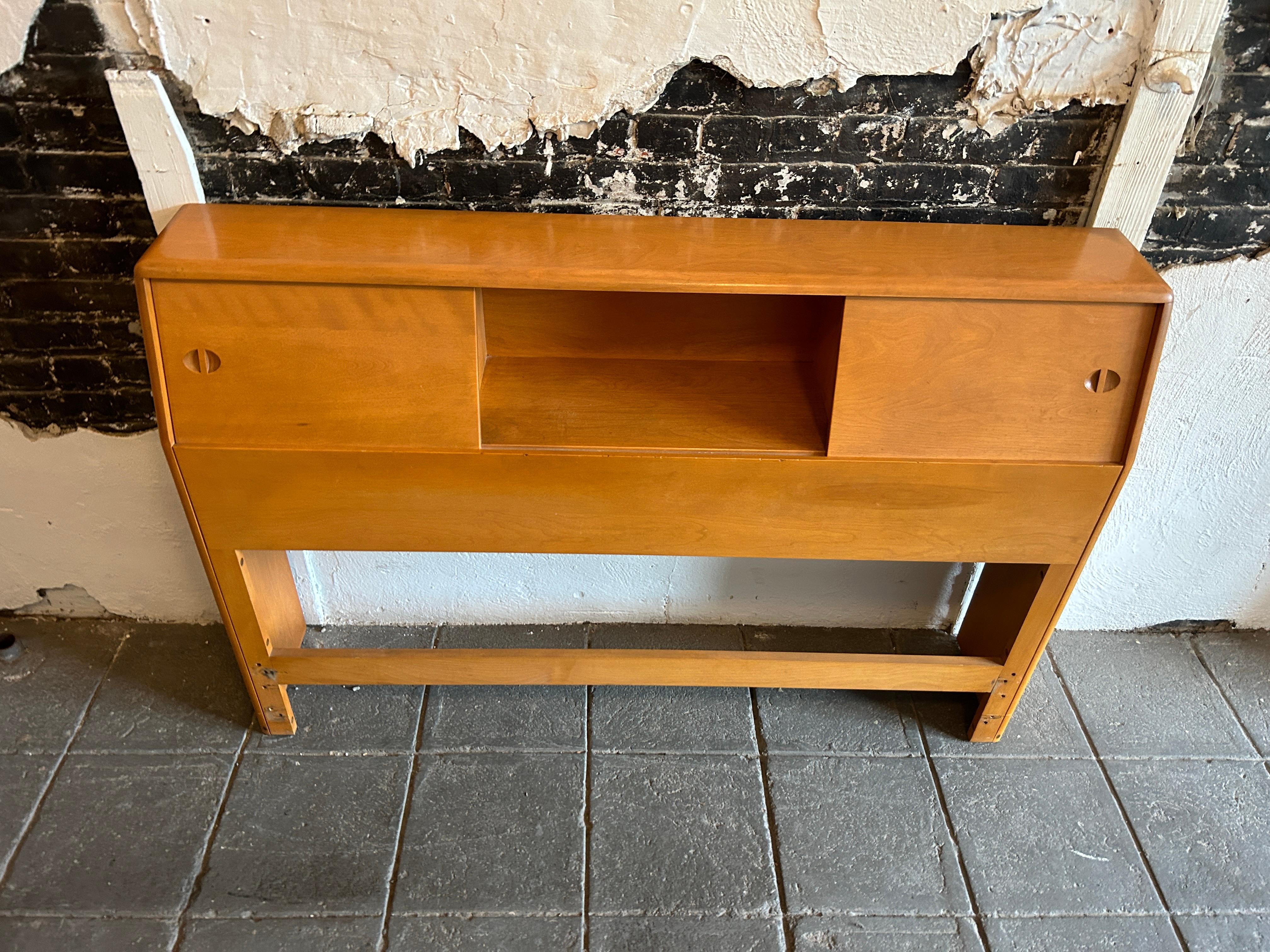 Mid-Century Modern solid maple full Size headboard with nightstands shelves. All one unit - with 2 sliding doors and 1 center open space Located in Brooklyn NYC.

55
