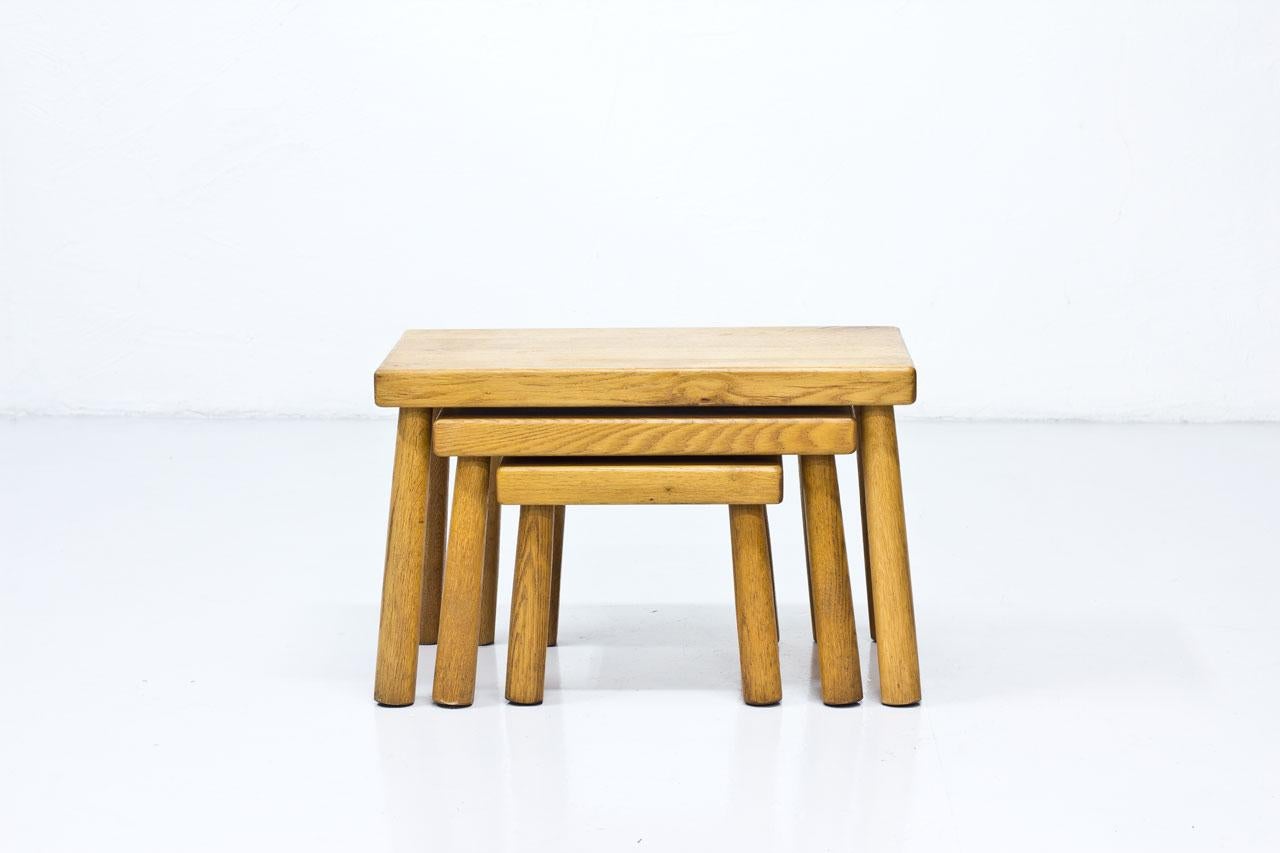 Set of nesting tables from unknown designer and maker, most likely manufactured in Belgium during the 1950s. Made from solid oak.

Dimensions: H 27.5 to 38.5 x W 32 to 60 x D 32cm.