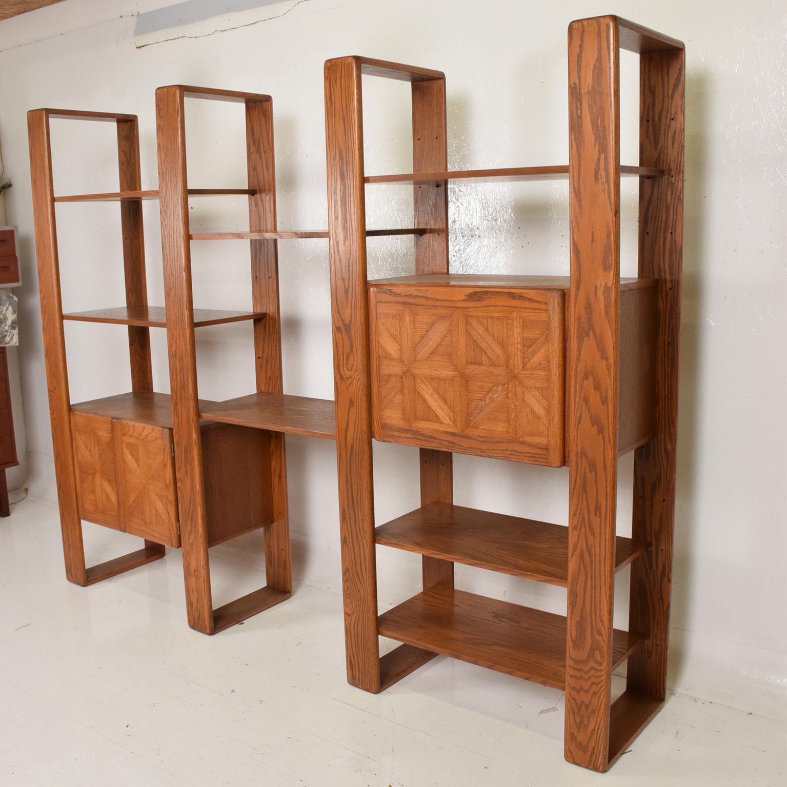 For your consideration, a Mid Century Modern Solid Oak Wood Wall Unit by Lou Hodges. USA circa 1970s. Firm and sturdy. Dimensions: Unit: 76