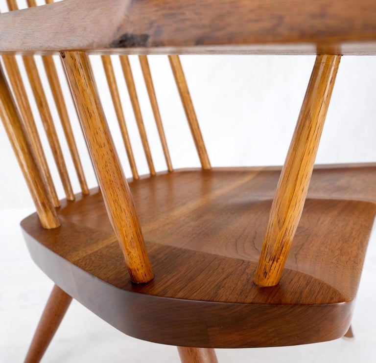 Mid-Century Modernsolid oiled walnut George Nakashima slab-arm lounge chair.