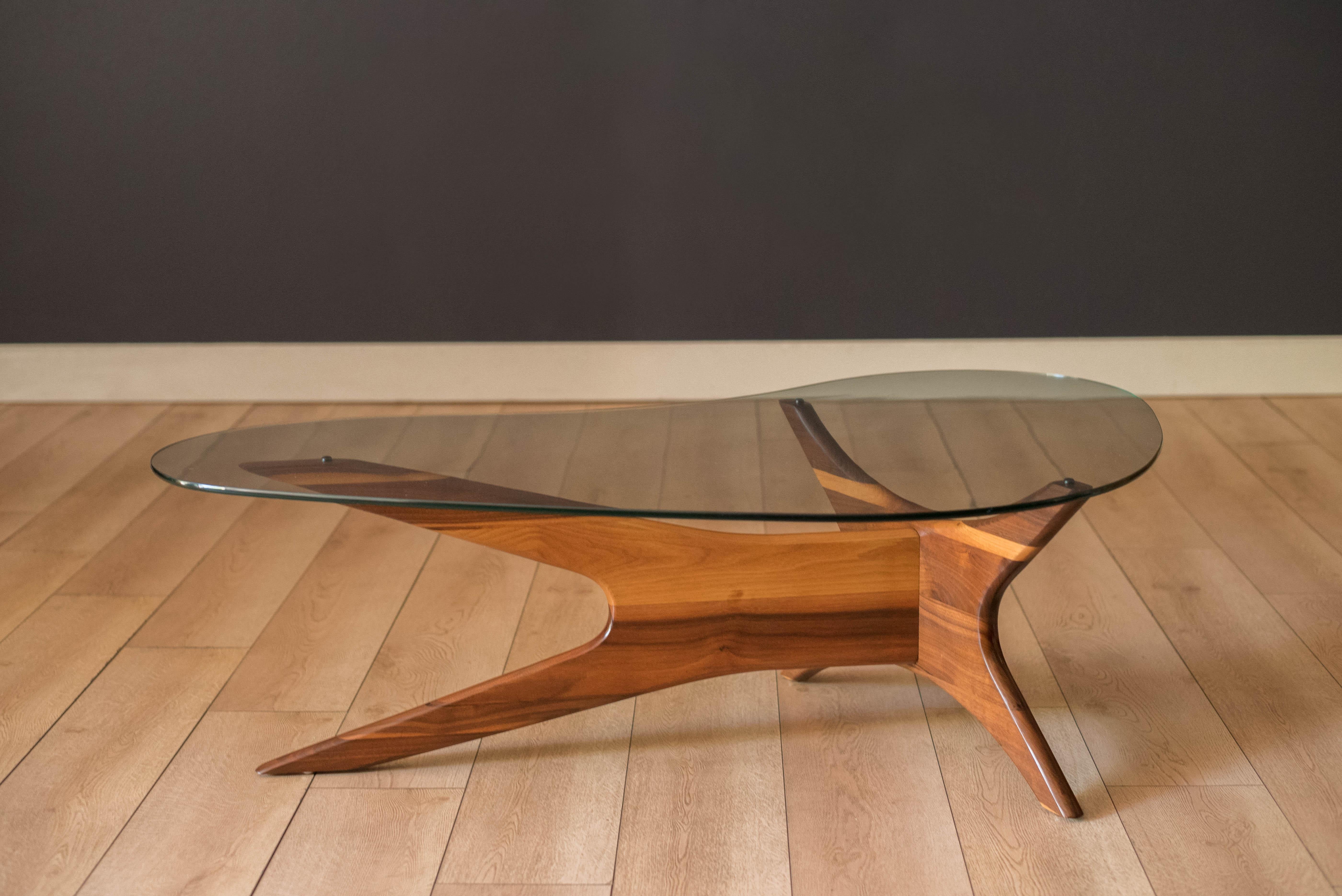 Vintage 'Jacks' coffee table model no. 1465-T designed by Adrian Pearsall for Craft Associates. Features a sculptural solid walnut supporting base and includes the original biomorphic glass shaped top. The matching pair of side tables are available