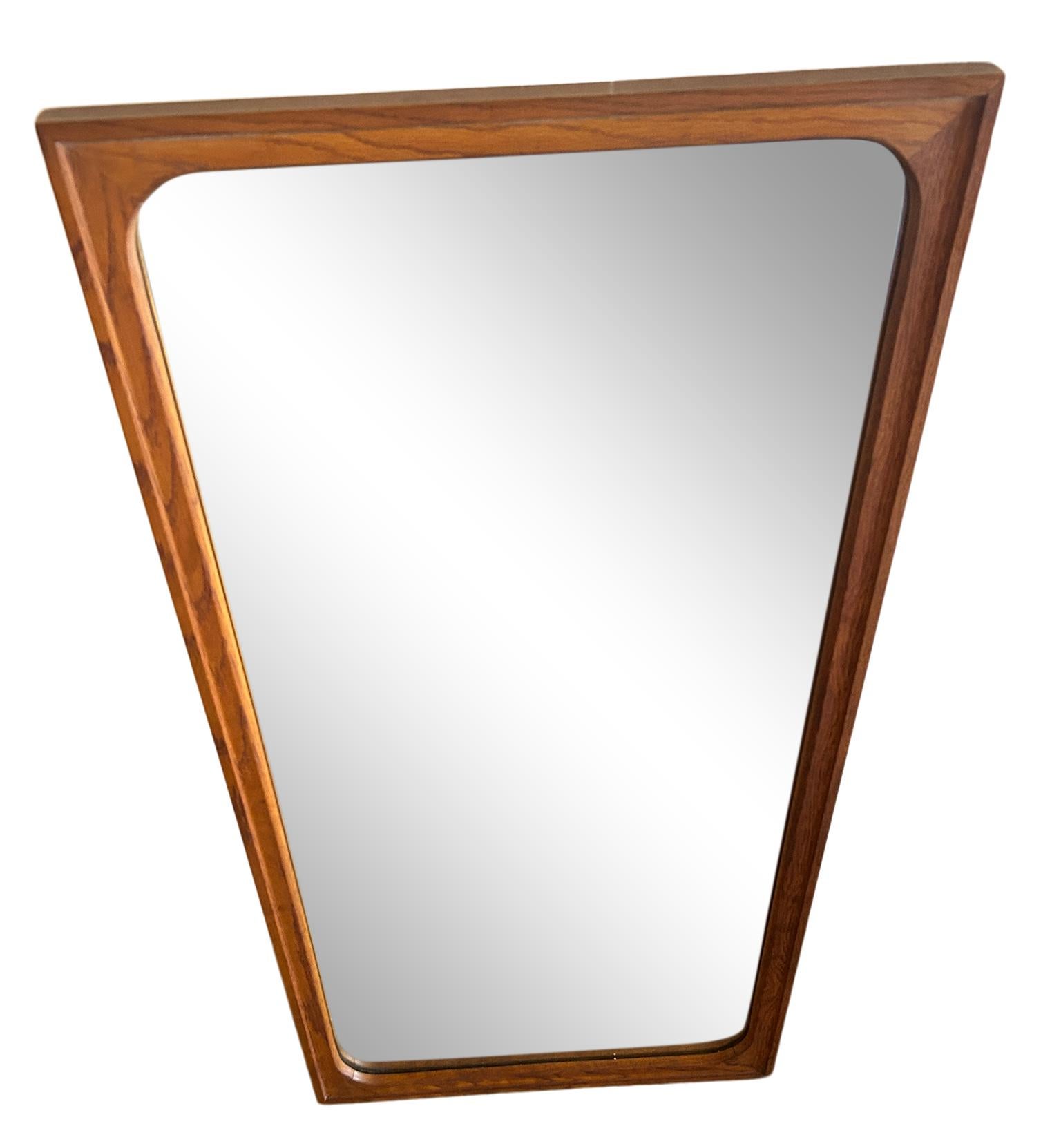 Mid-Century Modern solid walnut framed wall mirror with curved details on inside corners. Currently wired ready for use vertically. Rectangle mirror frame. Wood backing very good construction. Made in USA. Located in Brooklyn.

Measures 44” x 22” x