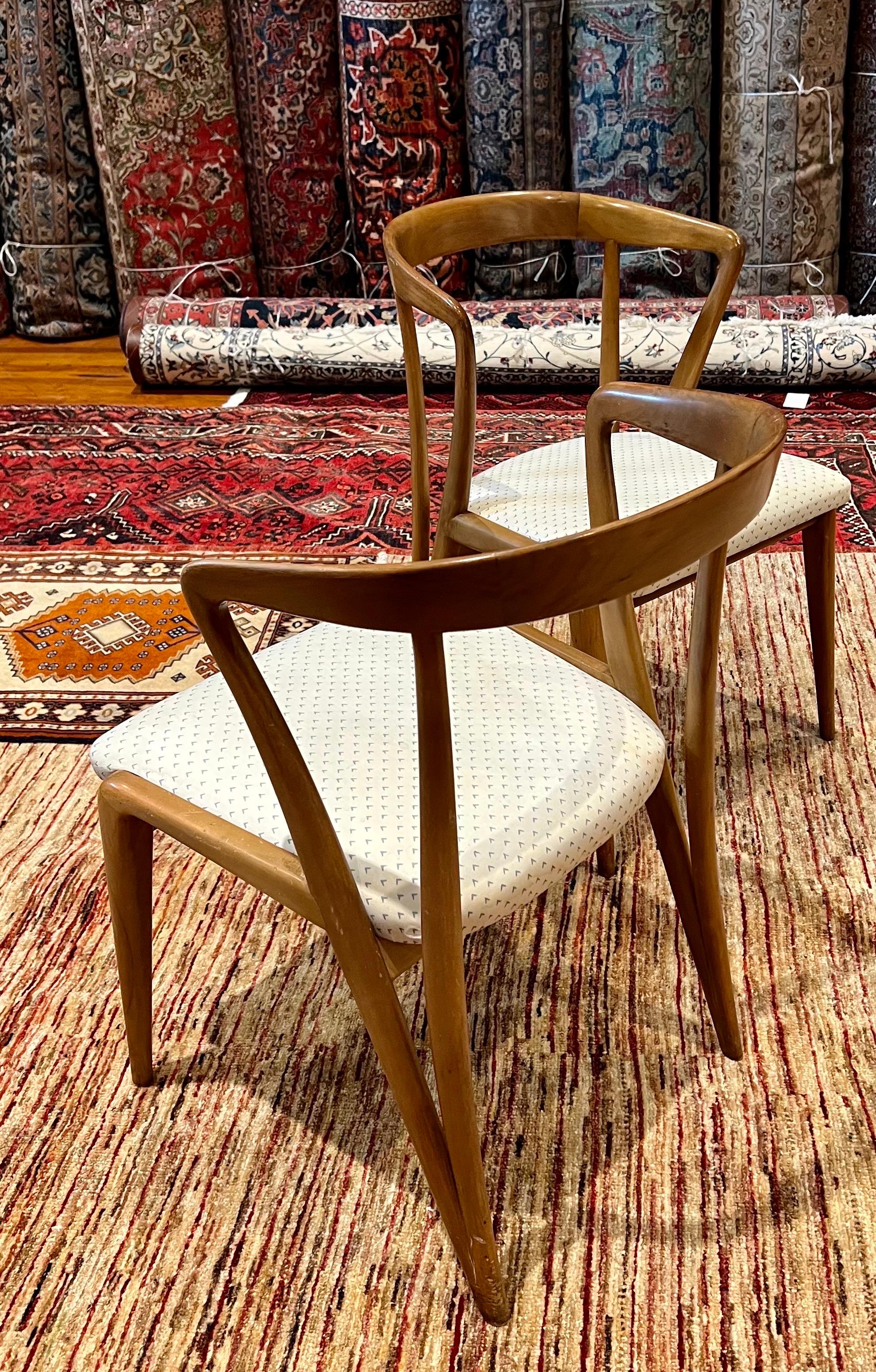 Beautiful and elegant pair of chairs designed by Bertha Schaefer for Singer & Sons, original finish recovered in cloth fabric. the chairs are sold in its original condition we have cleaned and oiled it nice clean condition.