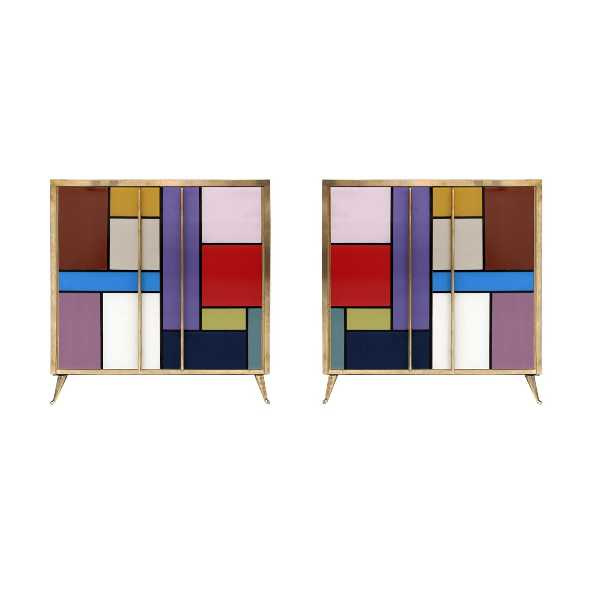 Pair of sideboards composed of two folding doors and one shelve inside. Original structure from 1950s made of solid wood and coated with colored glass. Details, handles and legs made of brass. 

Production time between 5 and 6 weeks.

Our main