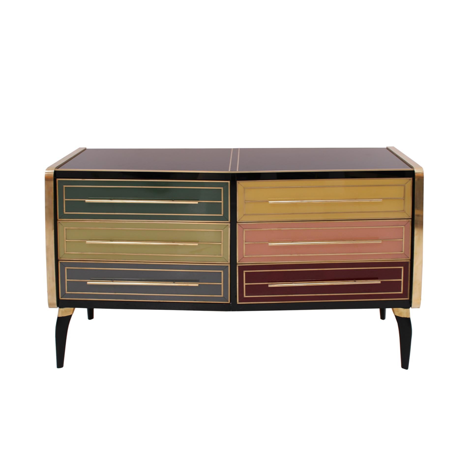 Italian sideboard composed of six drawers. Original structure from 50´s made of solid wood and covered in colored glass. Handles and details made of brass. Saber shape legs.

Production time between 5 and 6 weeks.

Our main target is customer