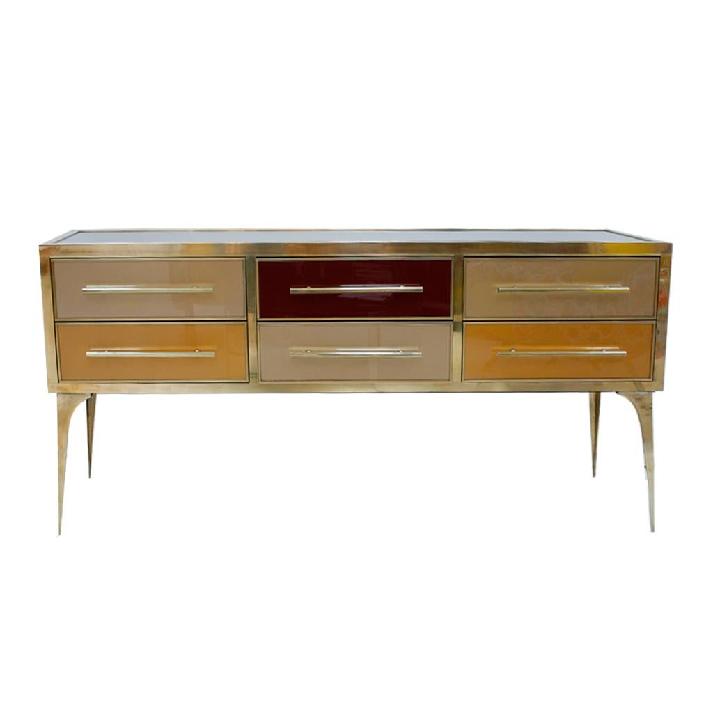 Made of solid wood structure from the 1950s and covered in Murano colored glass. Composed of six drawers with brass handles and legs.

Our main target is customer satisfaction, so we include in the price for this item professional and custom made