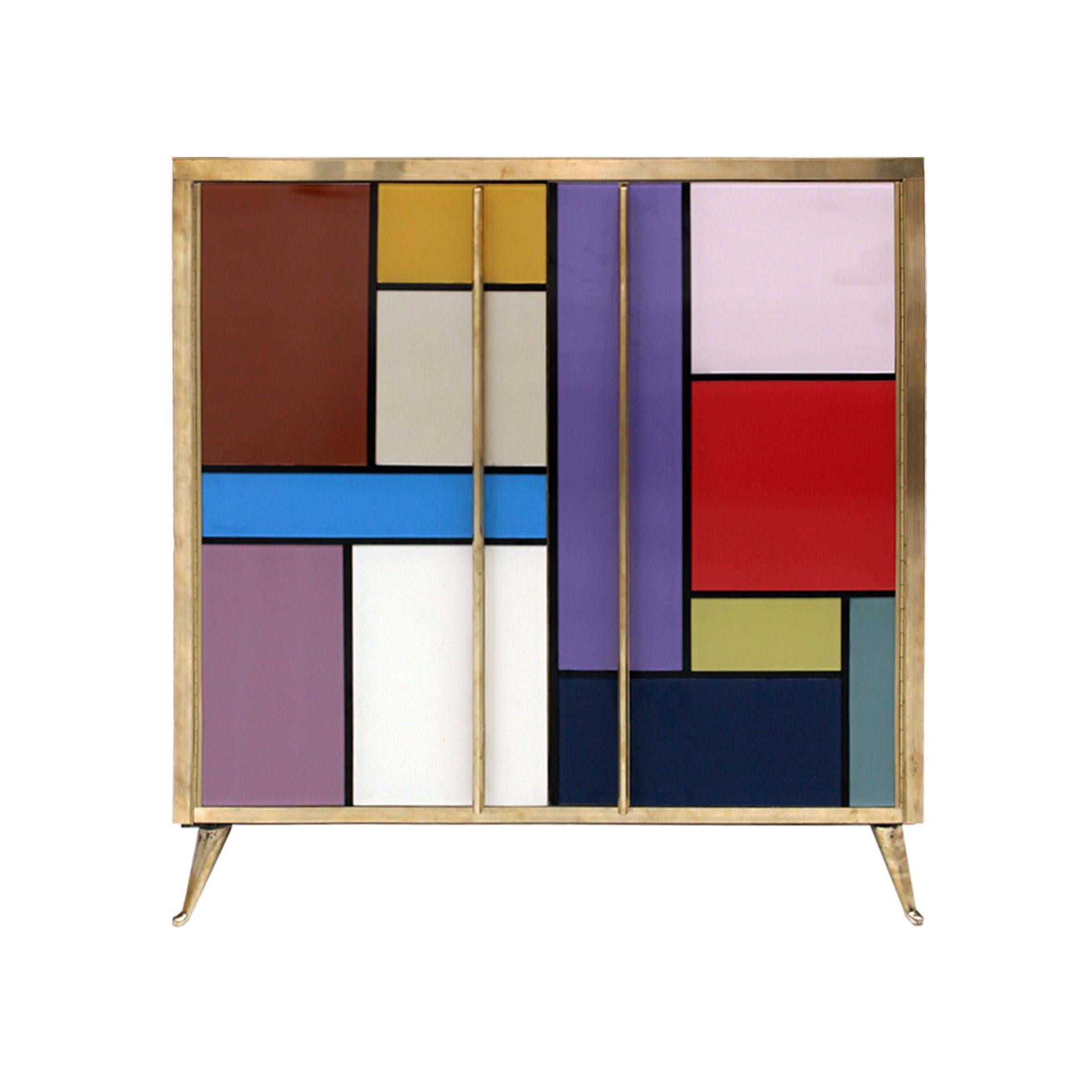Sideboard composed of two folding doors and one shelve inside. Original structure from 1950s made of solid wood and coated with colored glass. Details, handles and legs made of brass.

Production can last between 5 and 6 weeks.

Our main target is