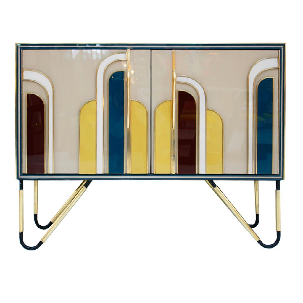Midcentury style pair of Italian sideboards. Original structure from 50S made of solid wood covered with colored Murano glass. Handles and legs made of brass.

Every item LA Studio offers is checked by our team of 10 craftsmen in our in-house