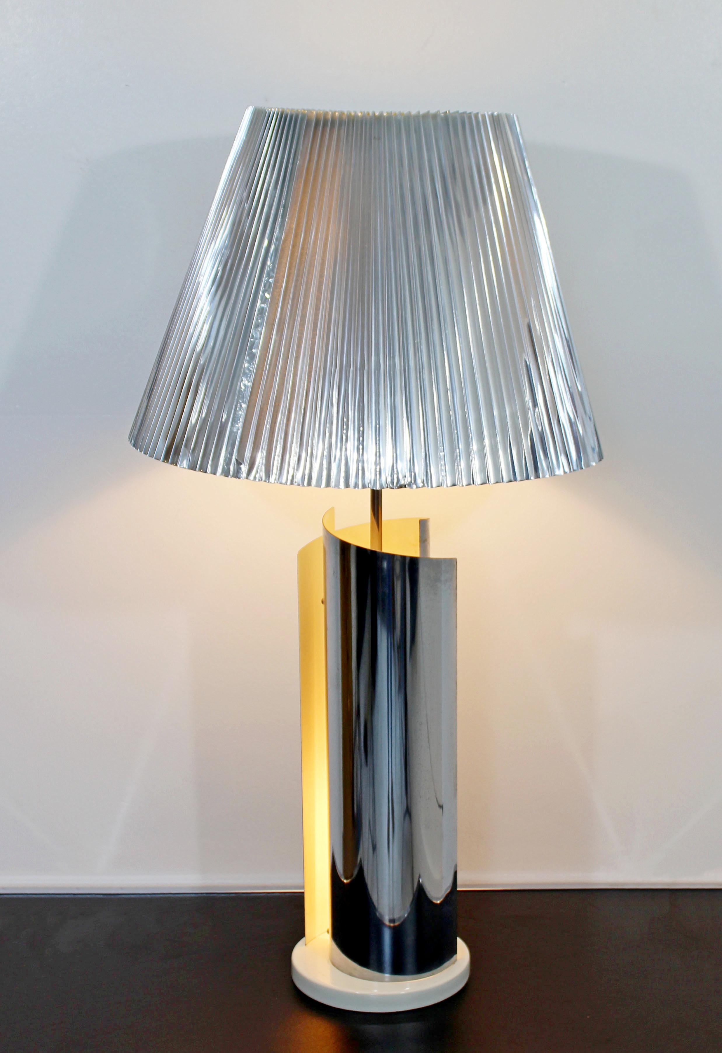 For your consideration is a magnificent Sonneman chrome table lamp, with original pleated chrome like shade and finial, circa the 1970s. In very good condition. Lights up from base and top. The dimensions of the lamp are 8