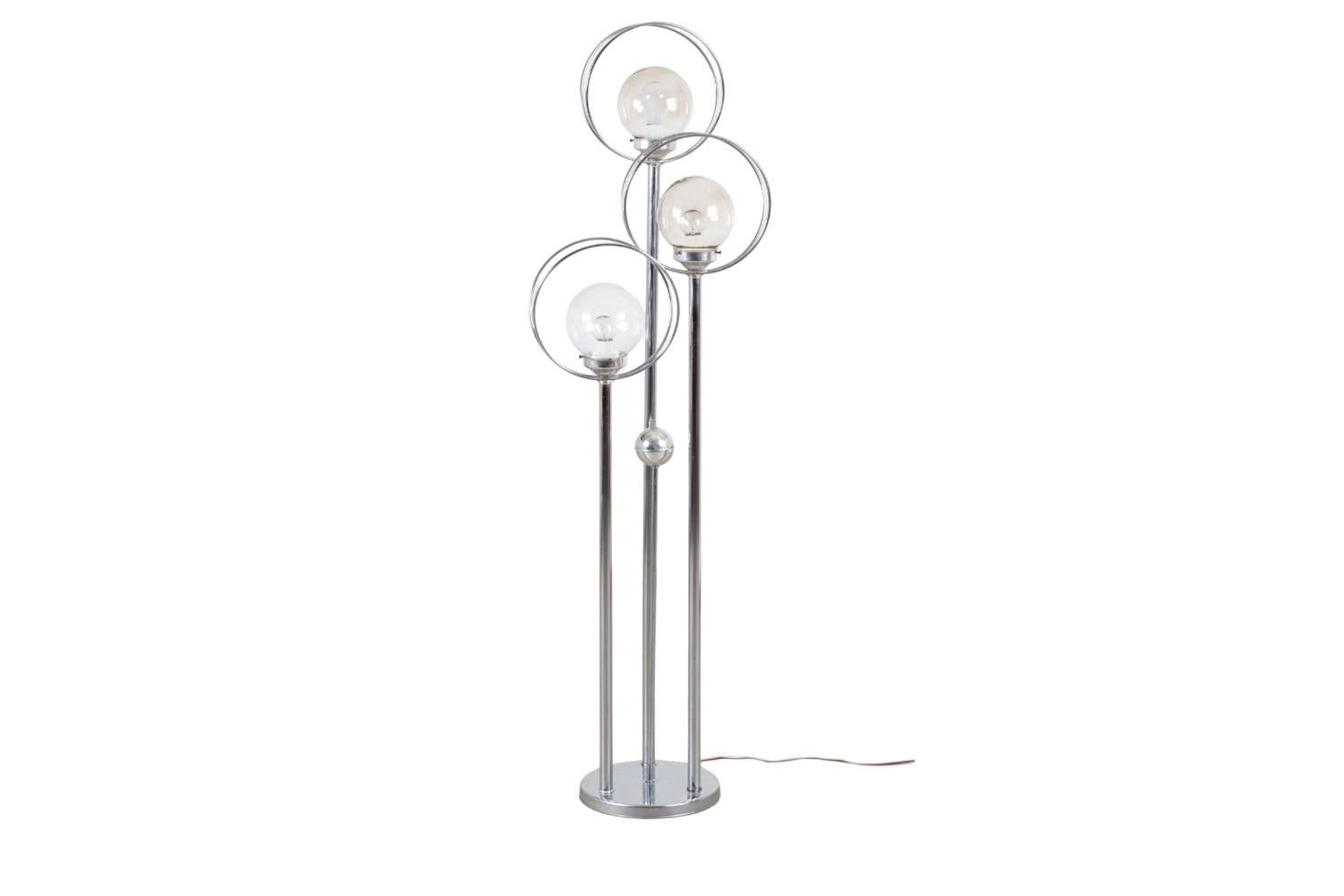 Stunning Mid-Century Modern Chrome three-tiered Orb Globe floor lamp, circa 1970's, lends a Space Age Atomic feel to the interior.  Features a beautiful round base, with three slender rods in varied heights, each supporting a sphere globe shade