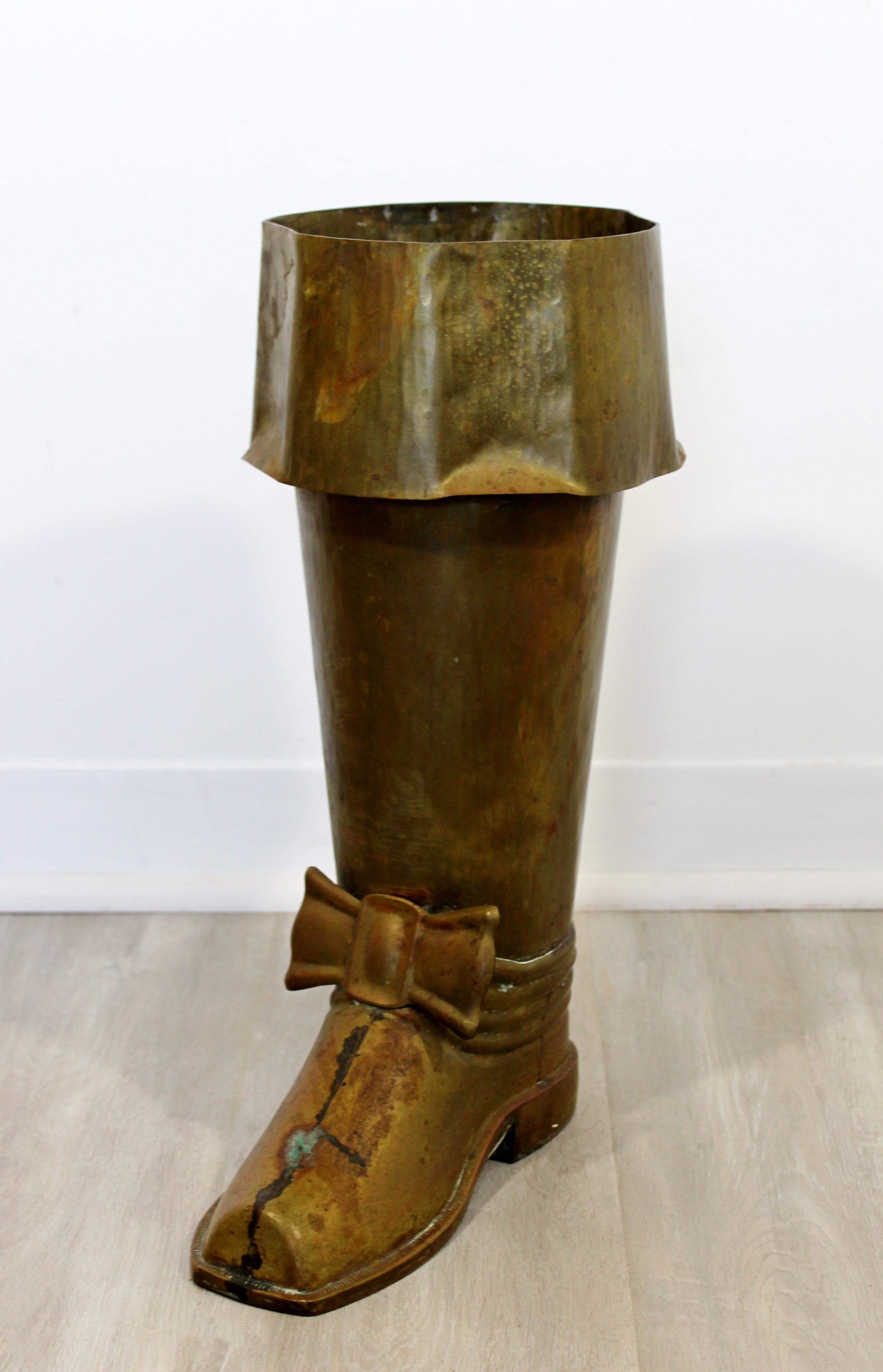 For your consideration is an intriguing, brass boot floor sculpture or umbrella stand, made in Spain, circa 1960s. In excellent condition. The dimensions are 12