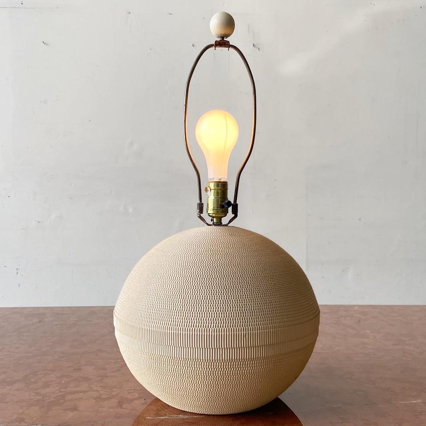 Incredible mid Century Modern table lamp. Body is made of a corrugated cardboard.

3 way lighting