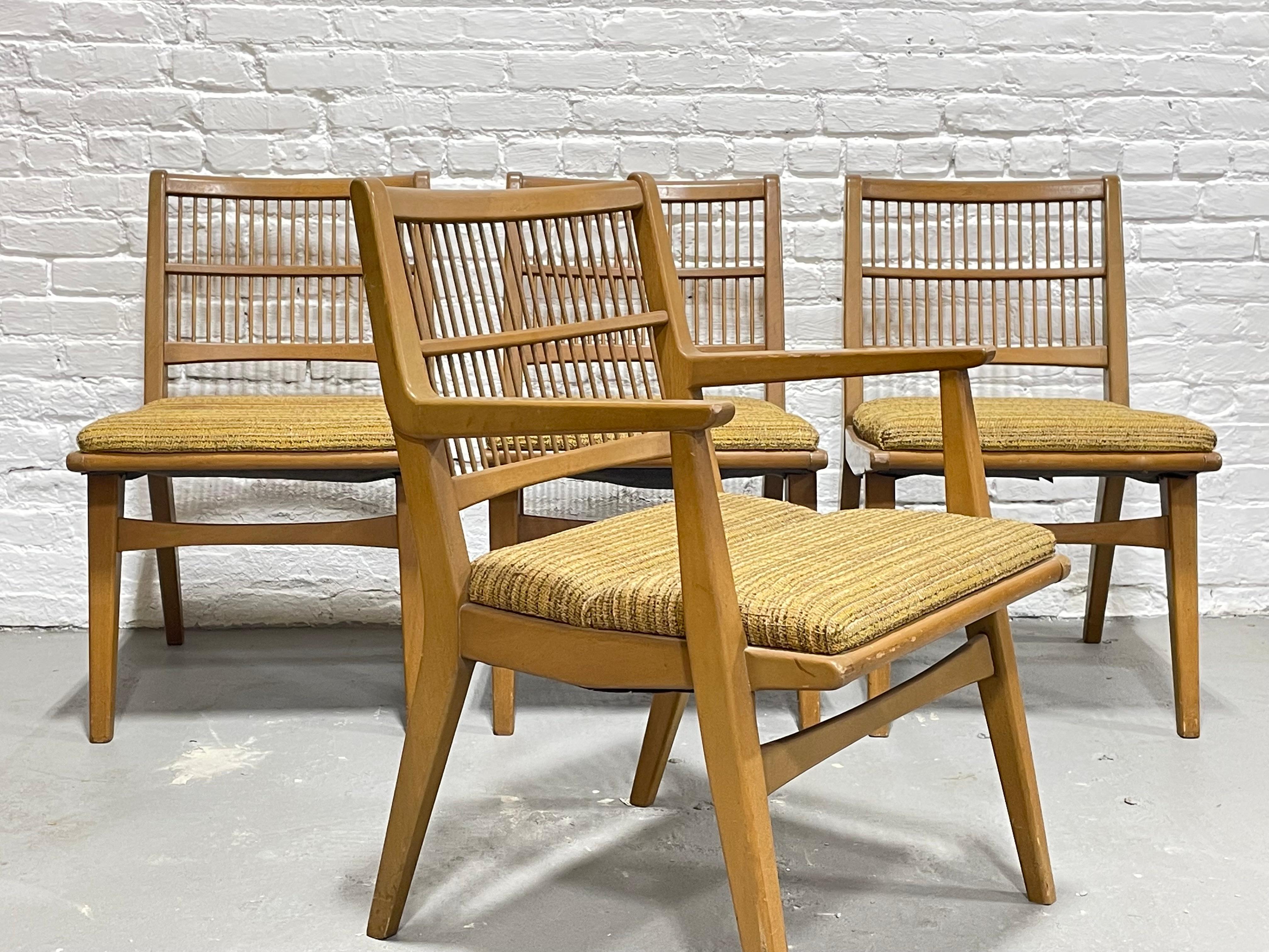 Mid-Century Modern Spindle Back Dining Chairs by Red Lion Furniture Company. This incredible set includes four spindle back dining chairs with original upholstery in a lovely retro mustard and brown soft nubby fabric. The chairs have a unique “bend”