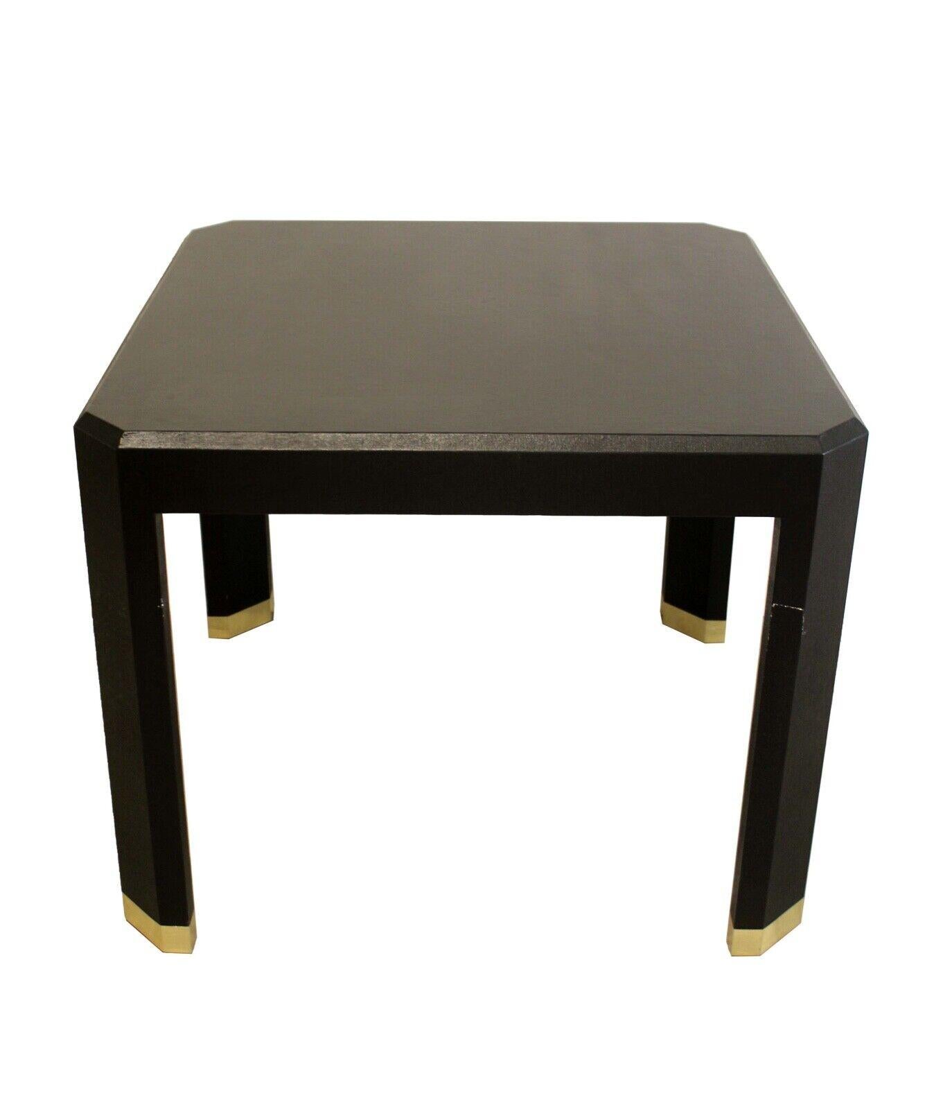 From Le Shoppe Too is this wonderful black grasscloth Springer style dinette or game table with brass caps on table legs. In very good condition. 
Dimensions: 36