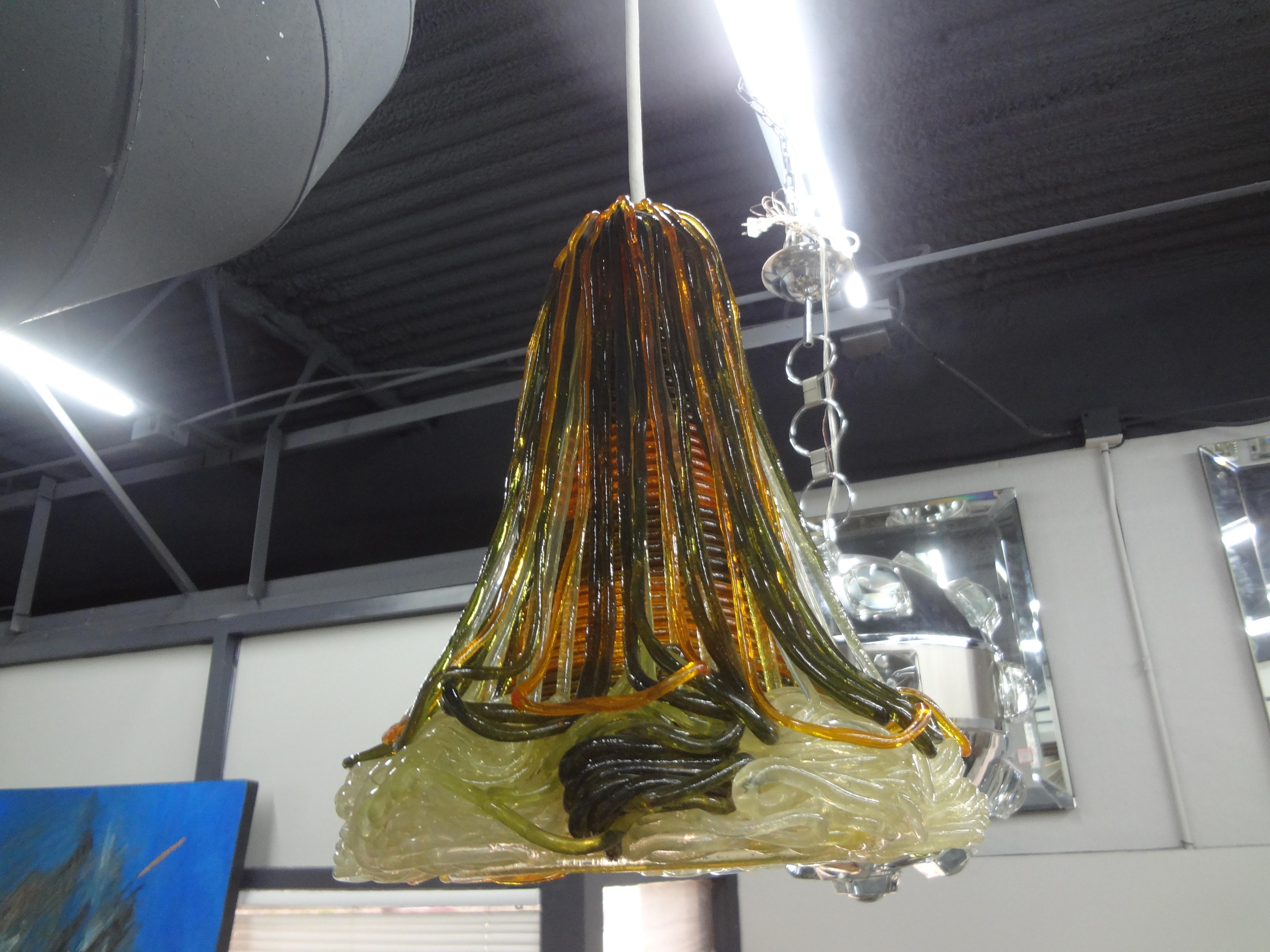 Mid Century Modern Spun Lucite Pendant or Lantern.
This stunning pendant or lantern was formed with translucent, green and orange lucite or acrylic in a bell shape newly wired with a new Edison socket. This unusual lantern casts the most beautiful