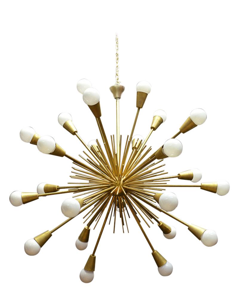 This Mid-Century Modern Sputnik chandelier is in good condition and is made out of solid brass features 24 arms. This lighting fixture has a sleek modern design, is wired to US standards, and is in working condition. This chandelier is sturdy,