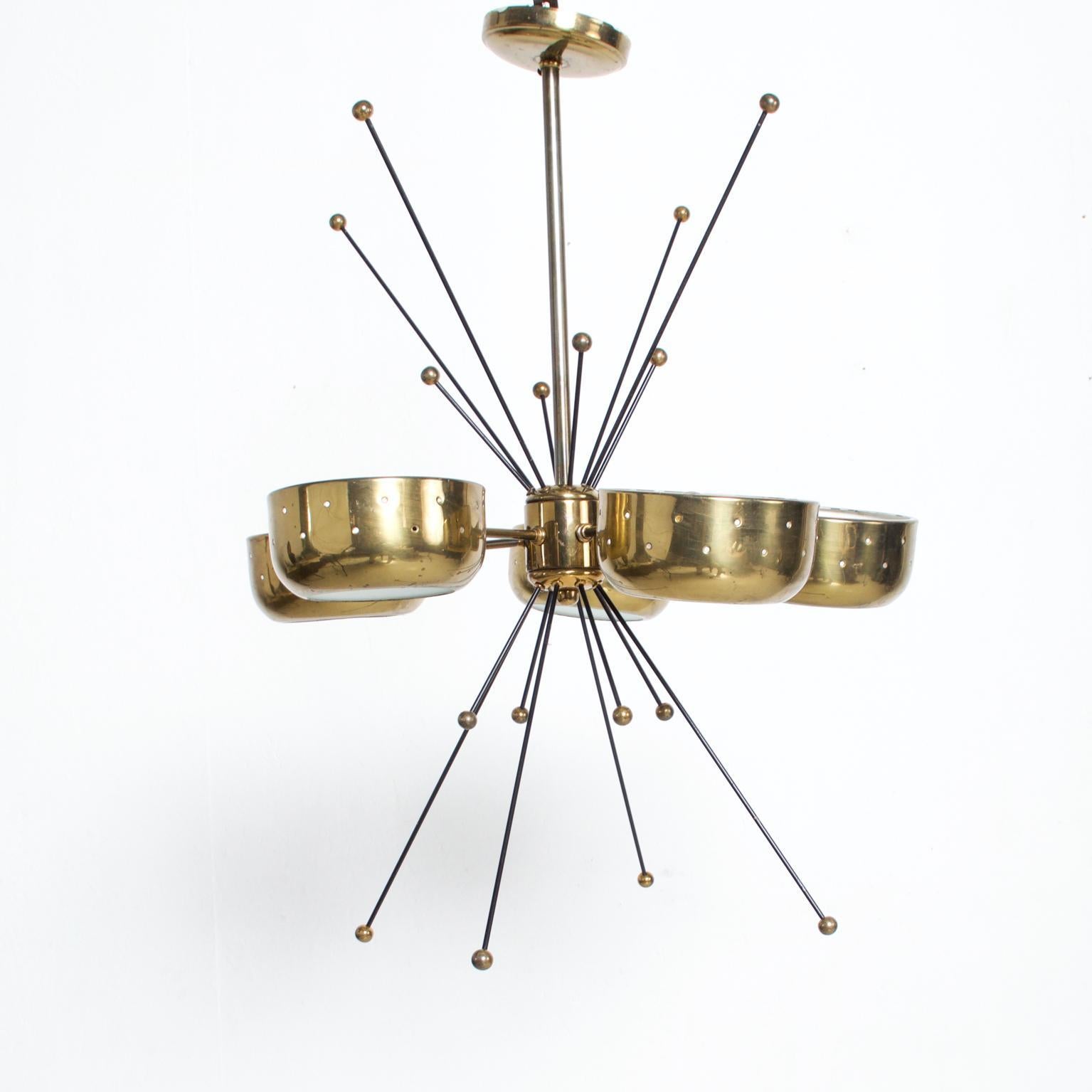 We are pleased to offer for your consideration a beautiful chandelier made in Italy, circa 1960s. Brass with glass and iron rods. Sputnik style. Unmarked, no information present on the maker. Attributed to Paavo Tynell Based on style. SKULIG12161907