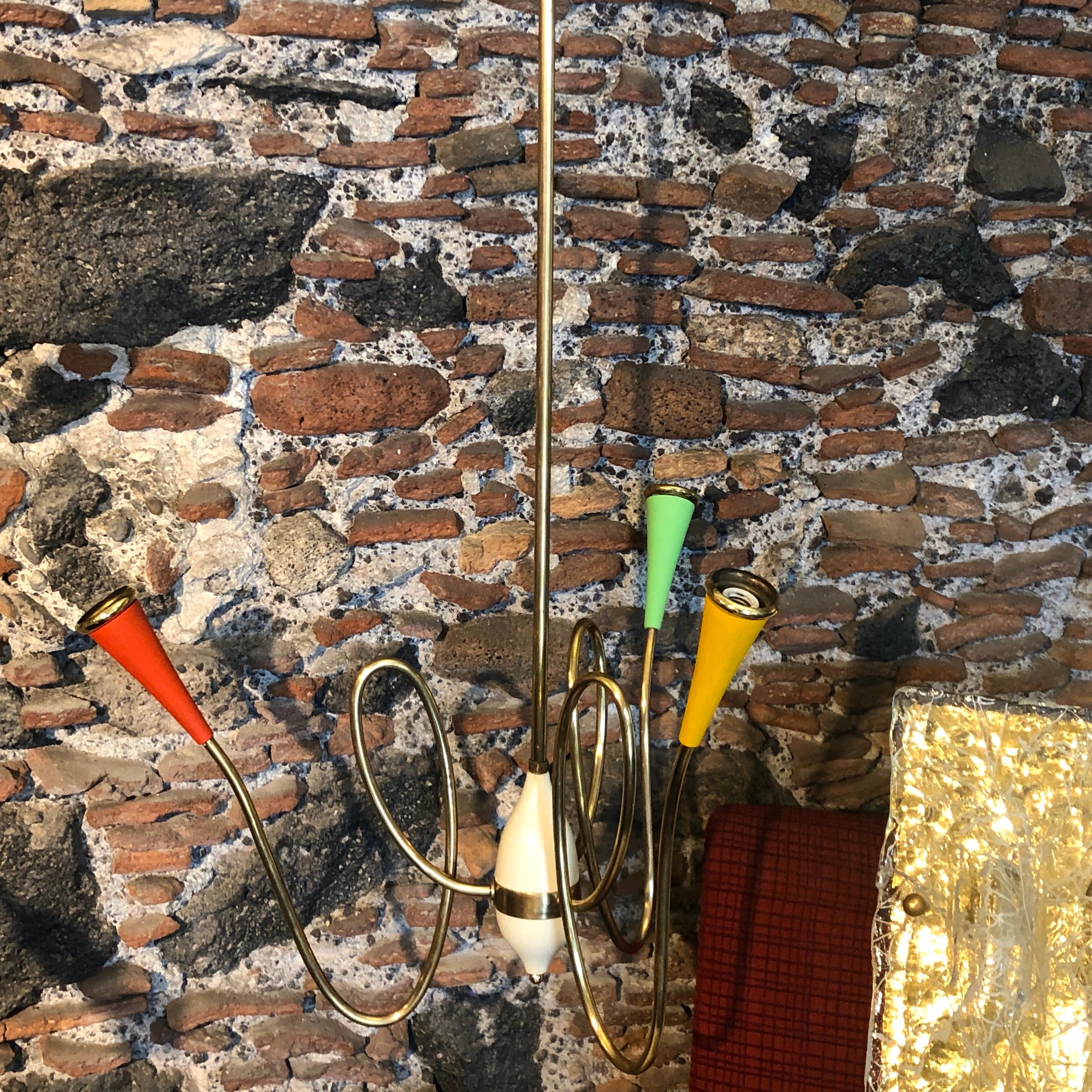 A brass Sputnik chandelier made in Italy in the 1950s. Fully restored electrical parts, It works 110-240 volts and need three regular e14 bulbs.