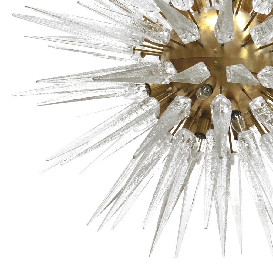 Sputnik chandelier made of Murano glass spikes and brass rods fixed to a central brass lacquered orb.
It requires twenty four light bulbs that are fixed to the central orb. Made in Italy.


