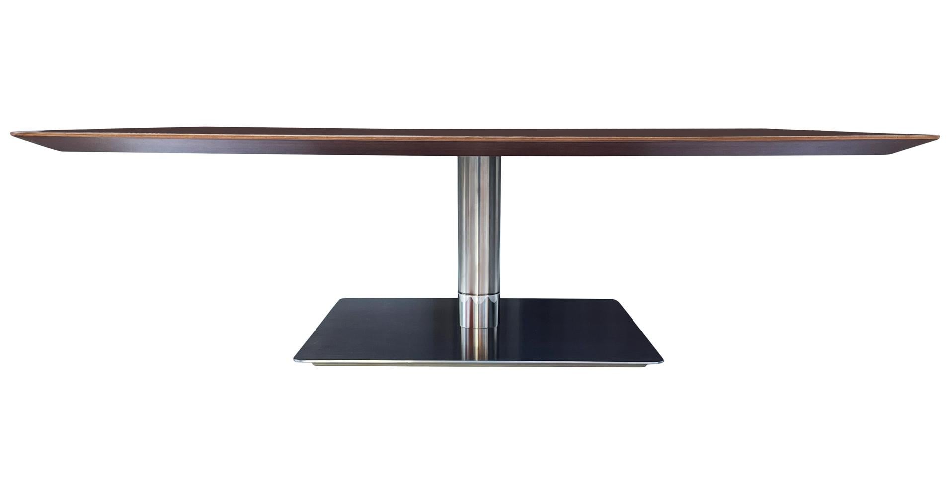 A simply gorgeous contemporary design made by Berhardt. It features a beautifully grained walnut top with heavy stainless steel base. Manufacturer label.