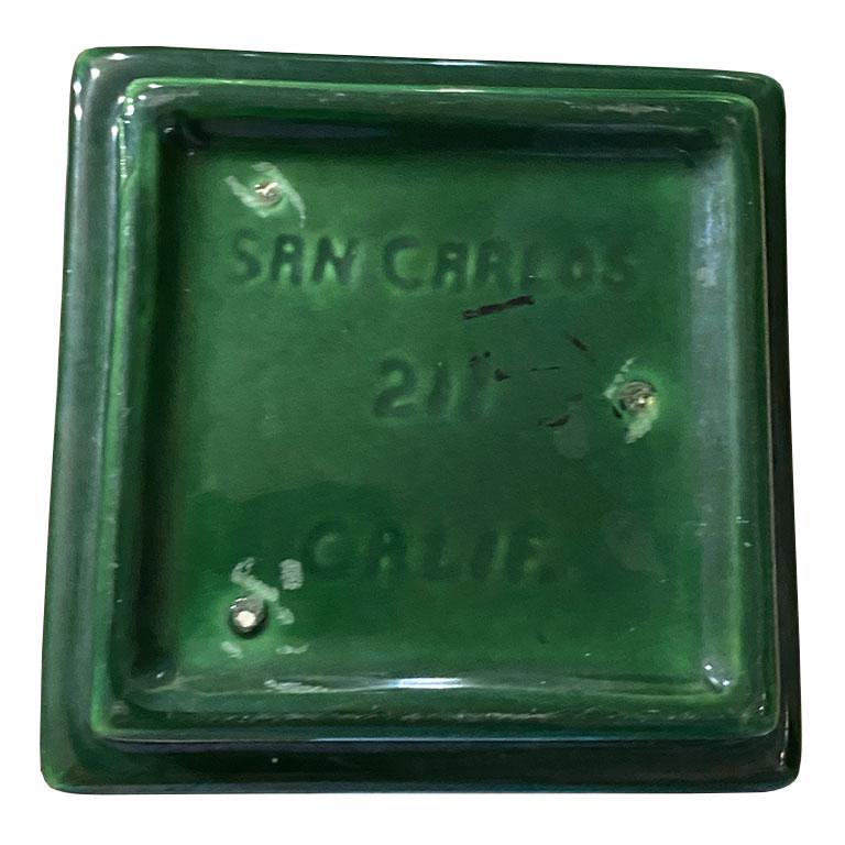 Glazed in a rich emerald blue or green, this MCM planter will complement any style. We imagine it in a chinoiserie space, filled with a lush bouquet of white fragrant flowers. Perhaps sitting on a side table, desk, or coffee table. It would also be
