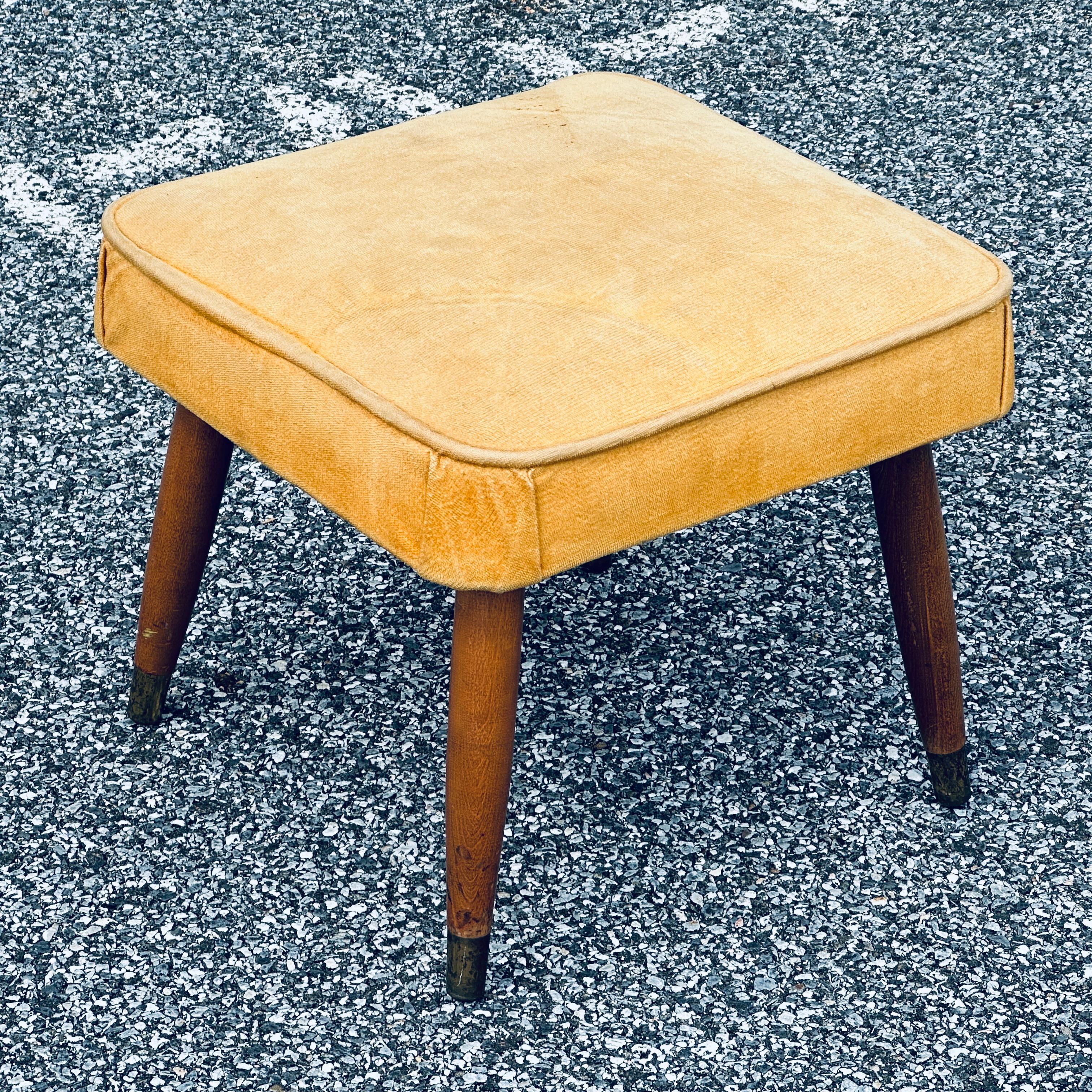 Square upholstered foot stool on brass capped tapered legs. circa 1960

Box 16x16x10