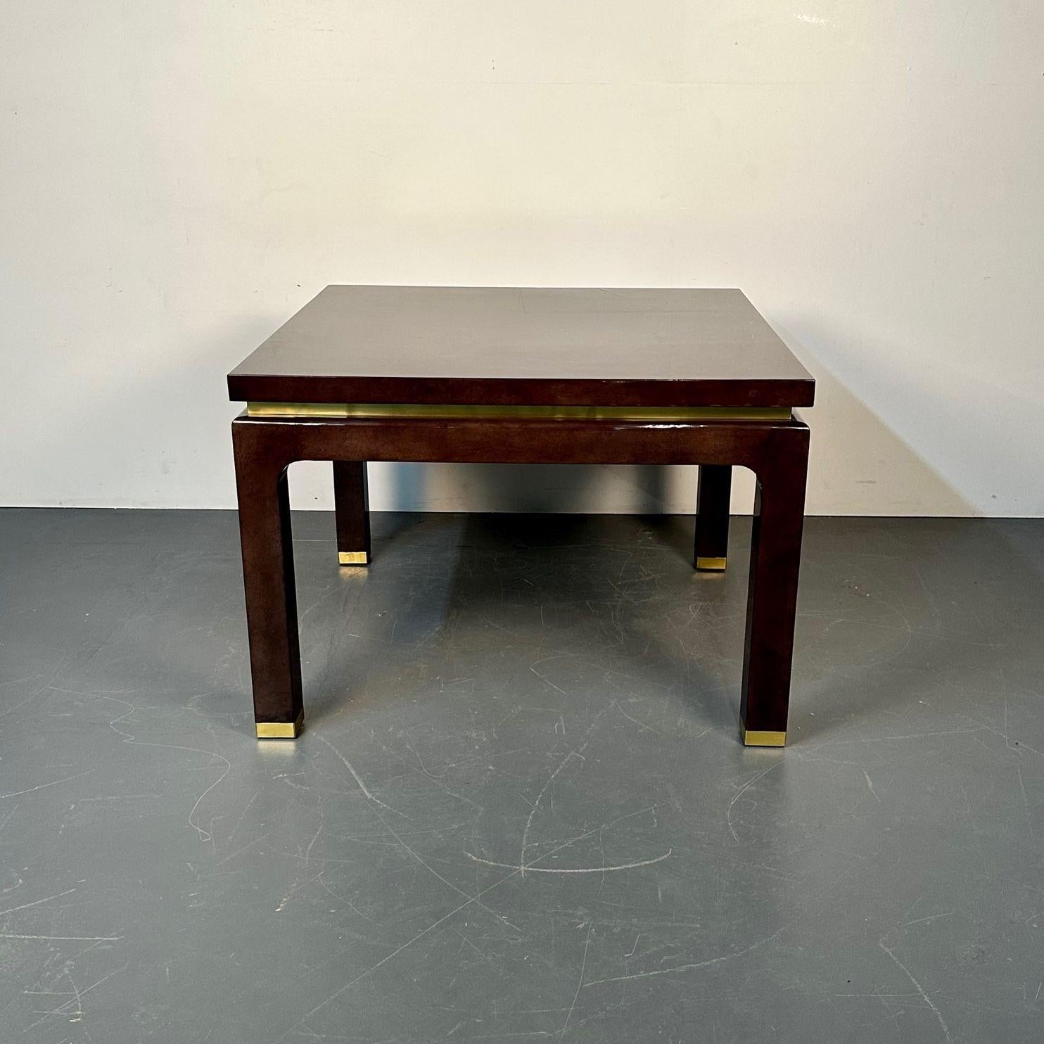 Mid-Century Modern square game / center table, lacquer and brass, springer style
 
Square game or breakfast table having a brown faux tortoise lacquer finish with brass accents along the sides and at the bottom of the legs. This table is