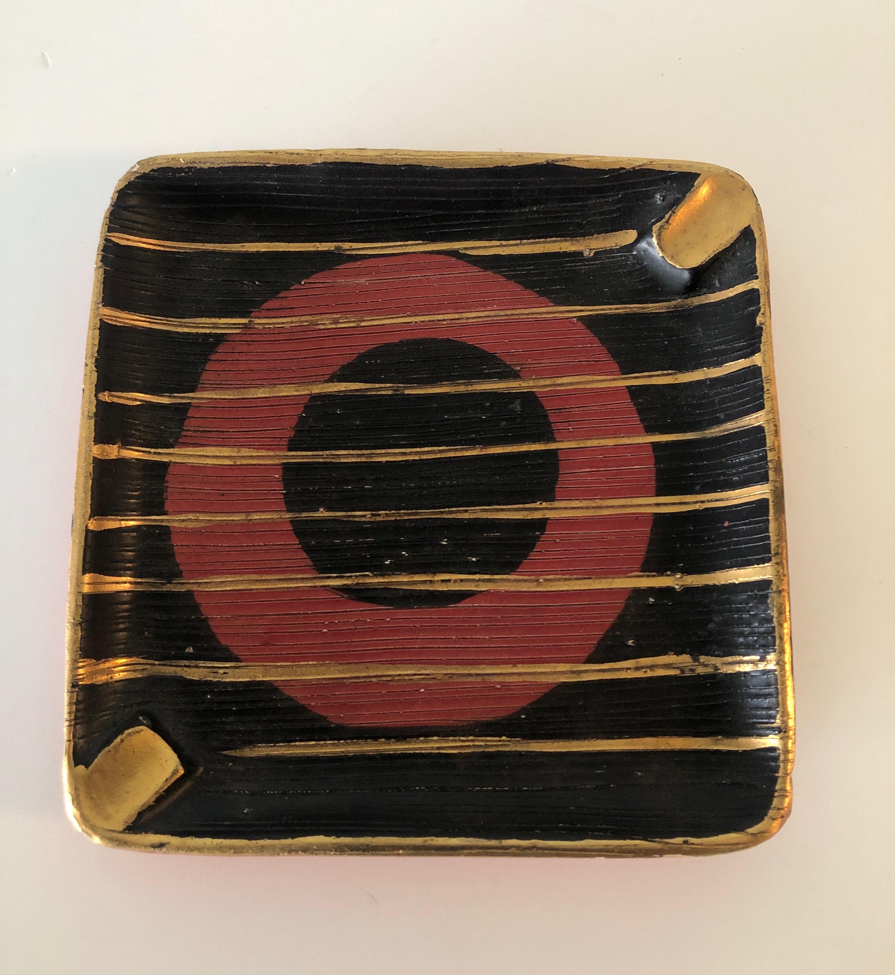 Square red and and black ashtray with gold paint details.
Mid-Century Modern ceramic 
Size: 7.5” x 7.5” x 1” H
Stamped made in Italy.
