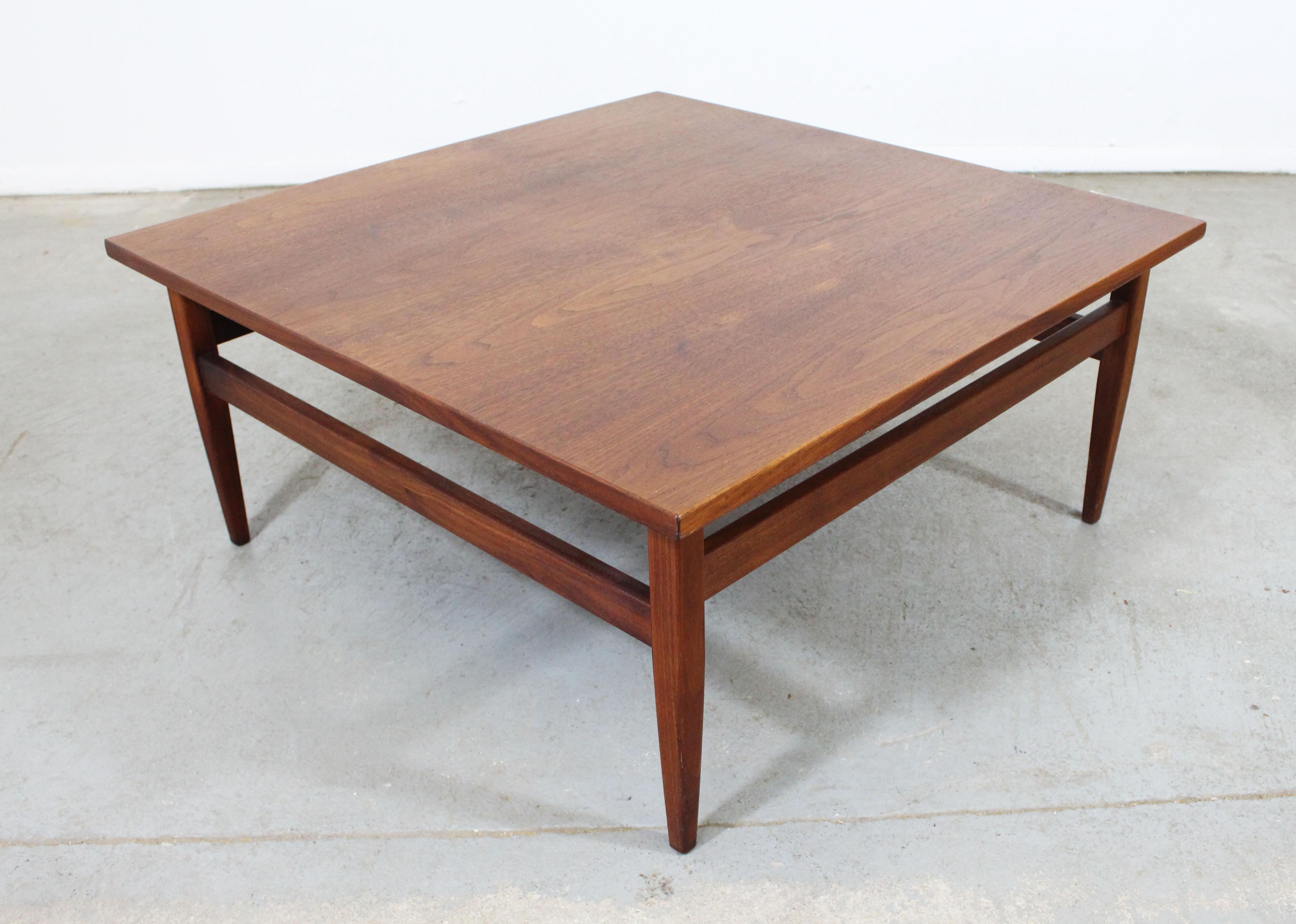Offered is a midcentury square teak coffee table. It is in excellent condition for its age, showing minor wear (small nick on top, age wear-see pictures). It is not signed. 

Dimensions: 
32