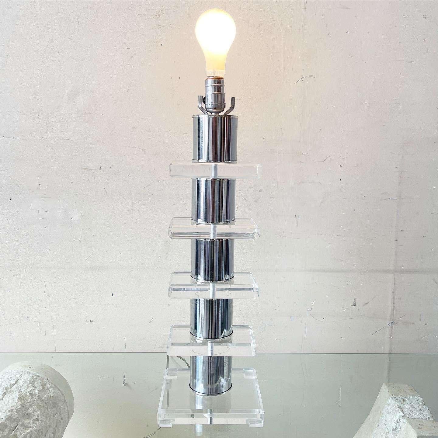 Incredible mid century modern table lamp. Features stacked chrome and lucite rectangles.
